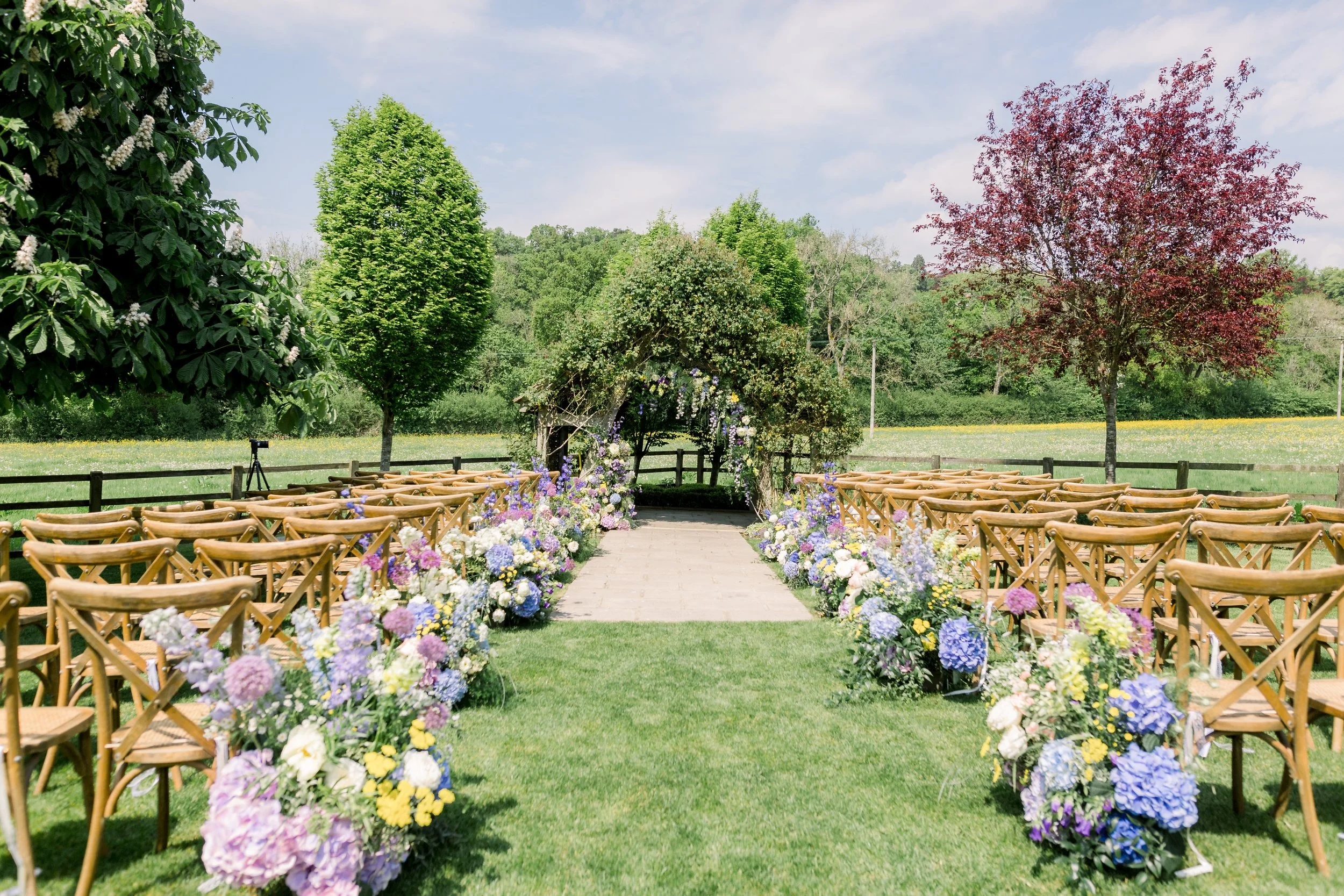 hyde-house-cotswolds-wedding-ceremony-arch-florals.jpg