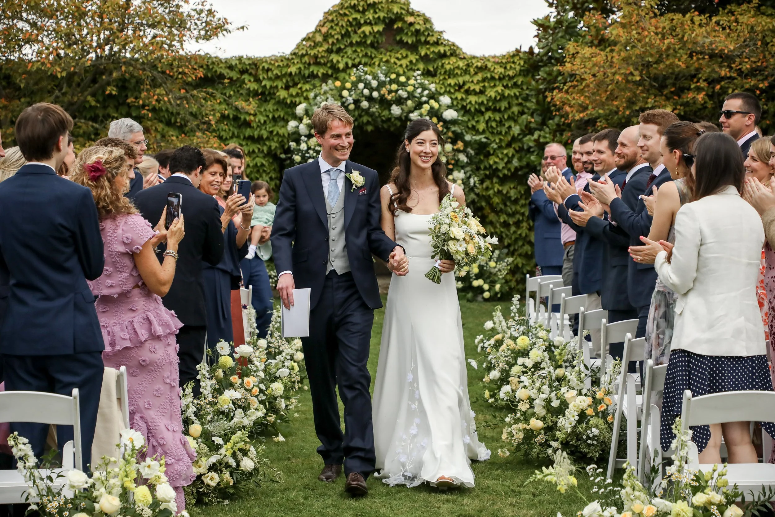 romantic-wedding-ceremony-yellow-wedding-florals.jpg