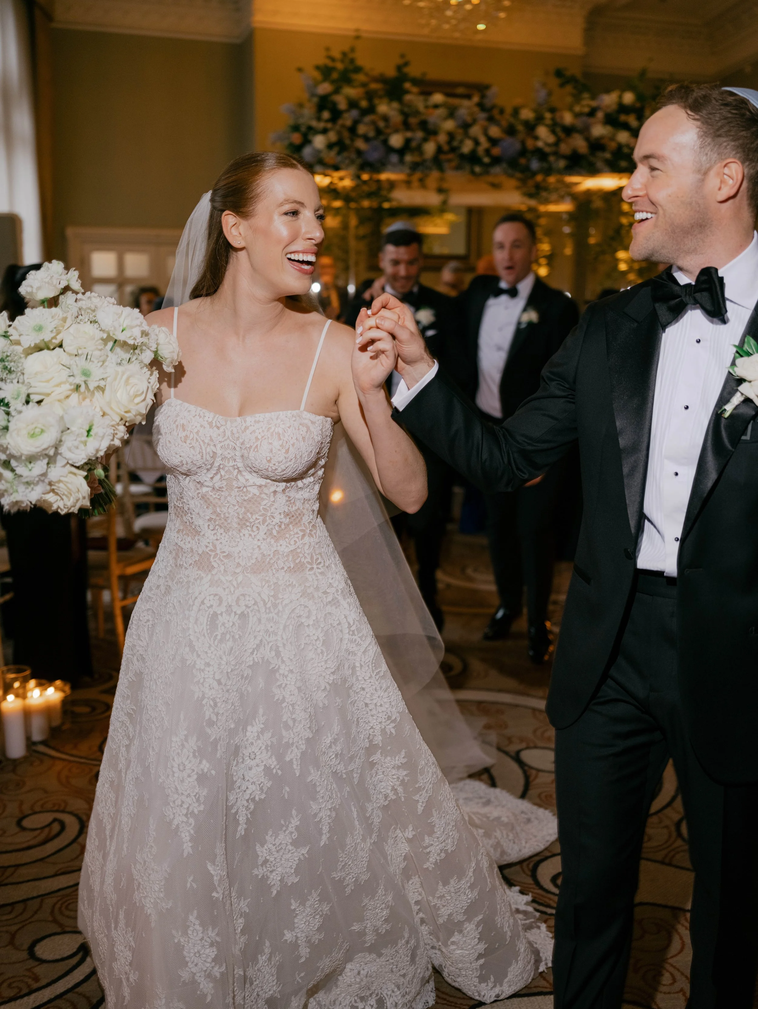 Bride and groom at the St. Pancras Hotel coming down the aisle