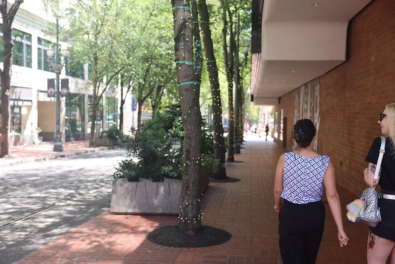 Two women walking down the street in Portland