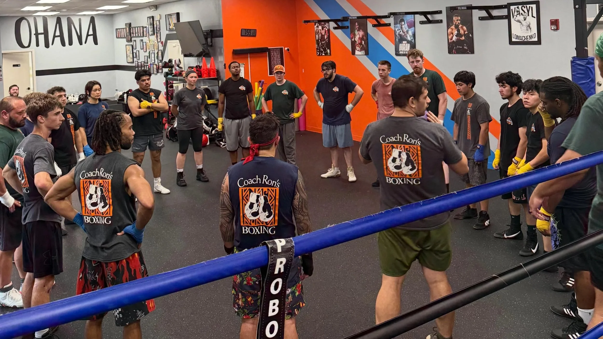 Students circle up at the end of training for Coach's summary