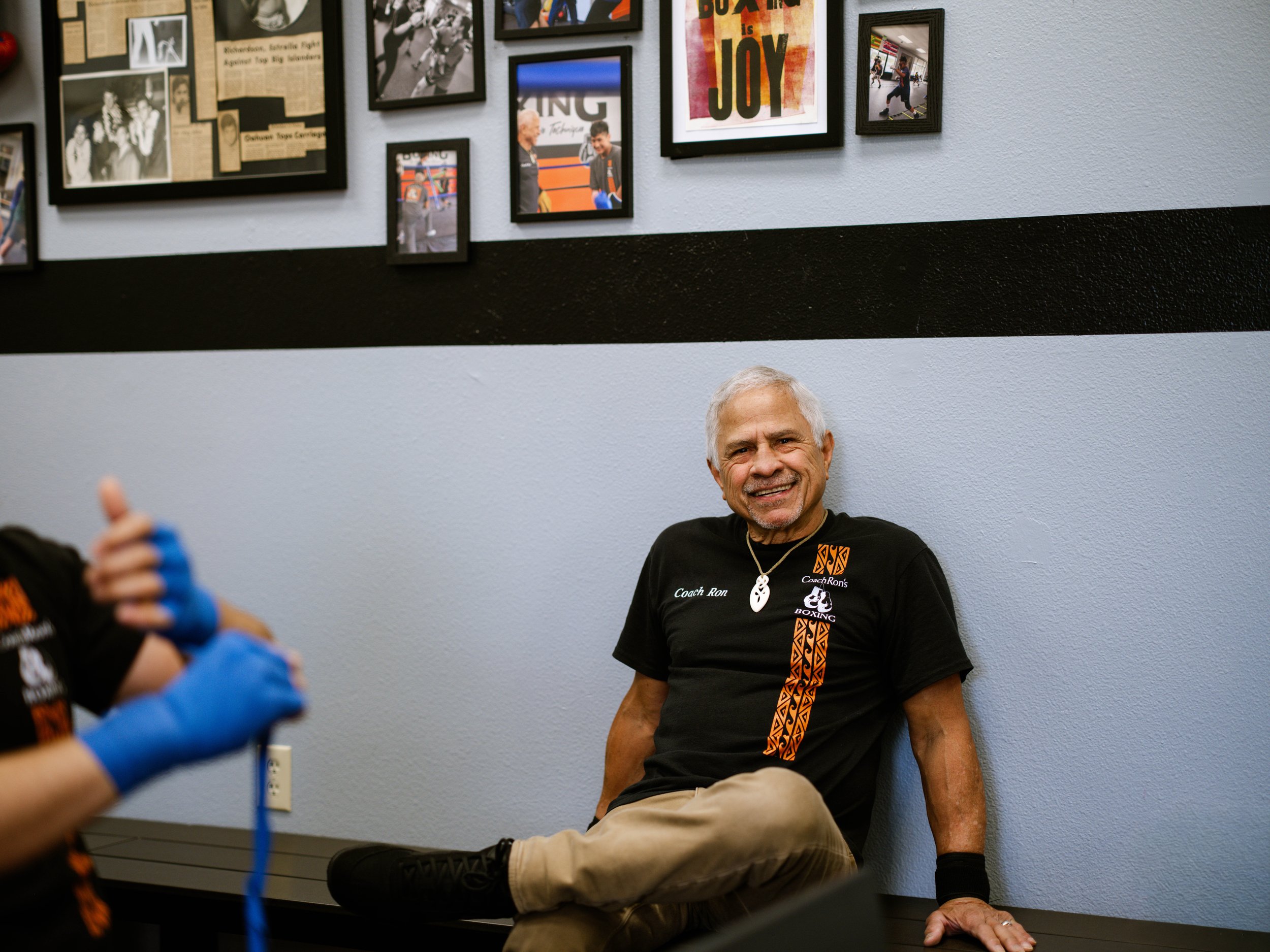 Coach ron sitting on the benches before a training session