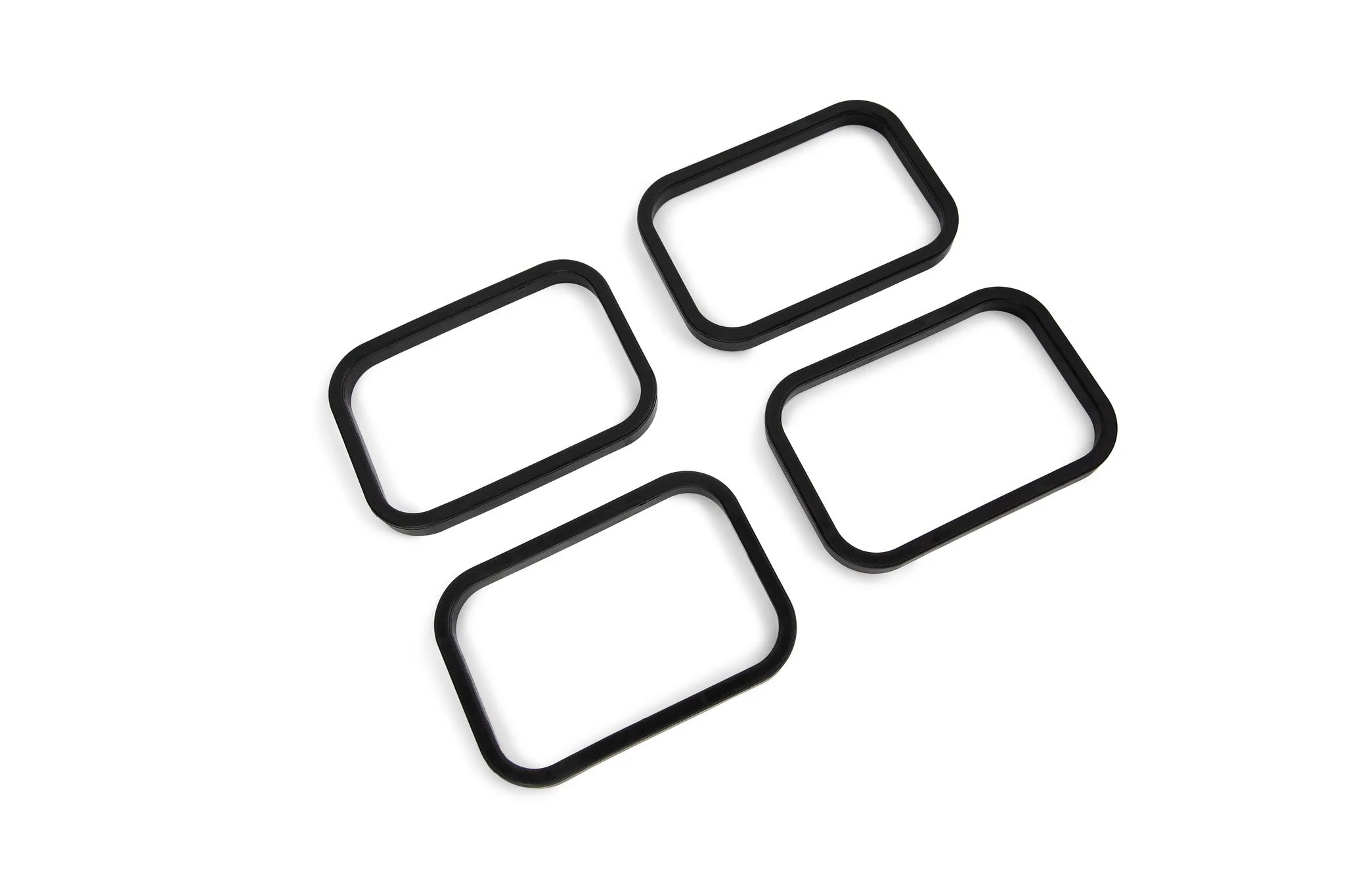 four black SpoutTrim caps on a white background