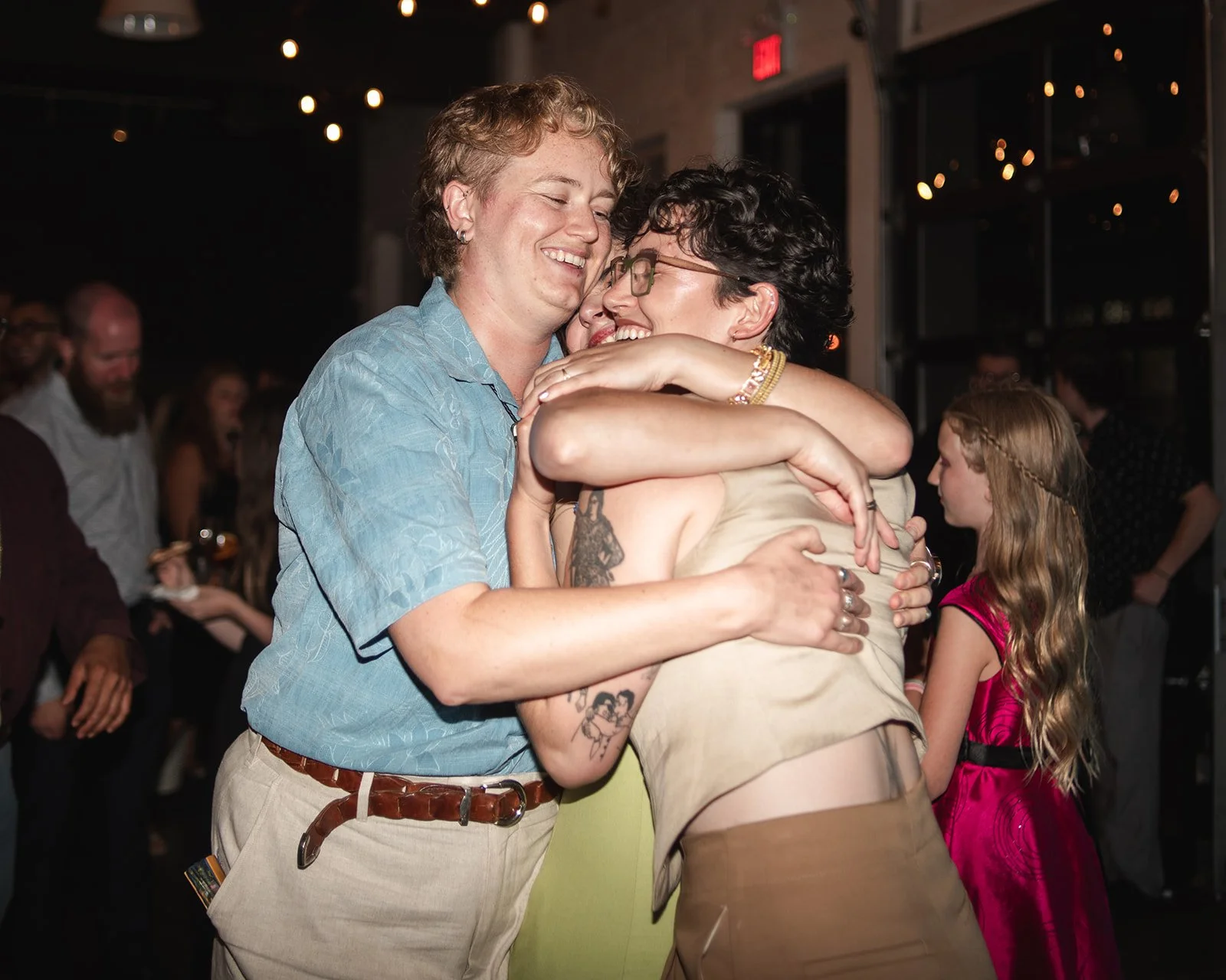 Friends Hugging on the Dance Floor