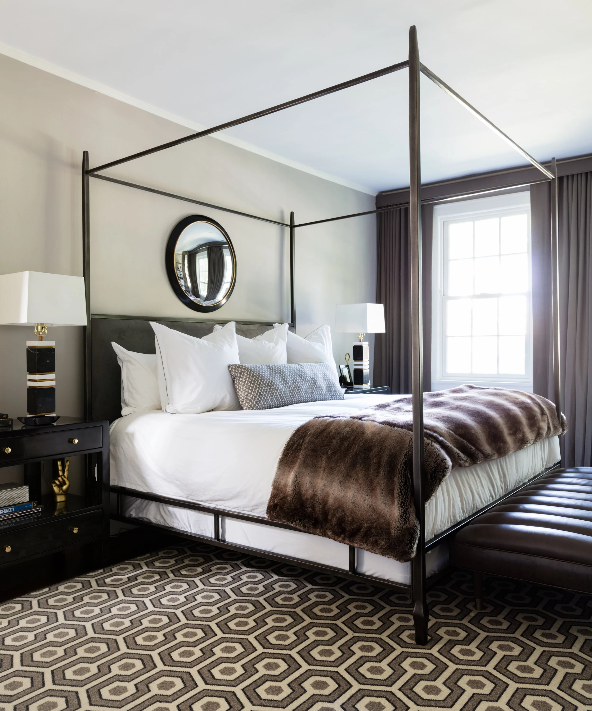 Velvet drapery panels layered in bedroom.