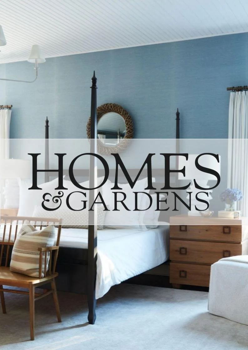 Decorated bedroom with a four-poster bed, a wooden chest of drawers, a round mirror, and curtains in a cozy room located in Greenwich, CT.