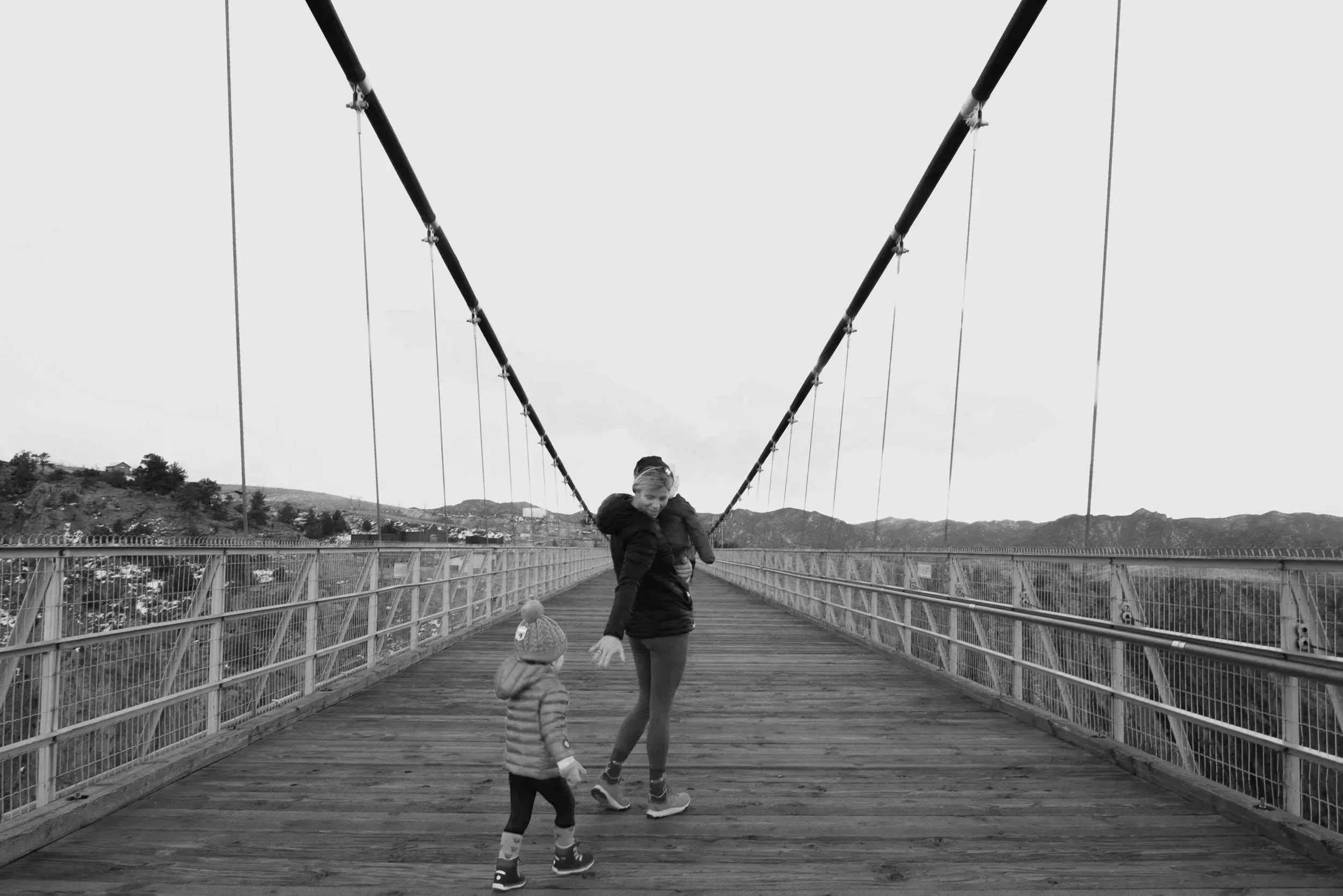 Business owner walking across a bridge, symbolizing transition and exit planning