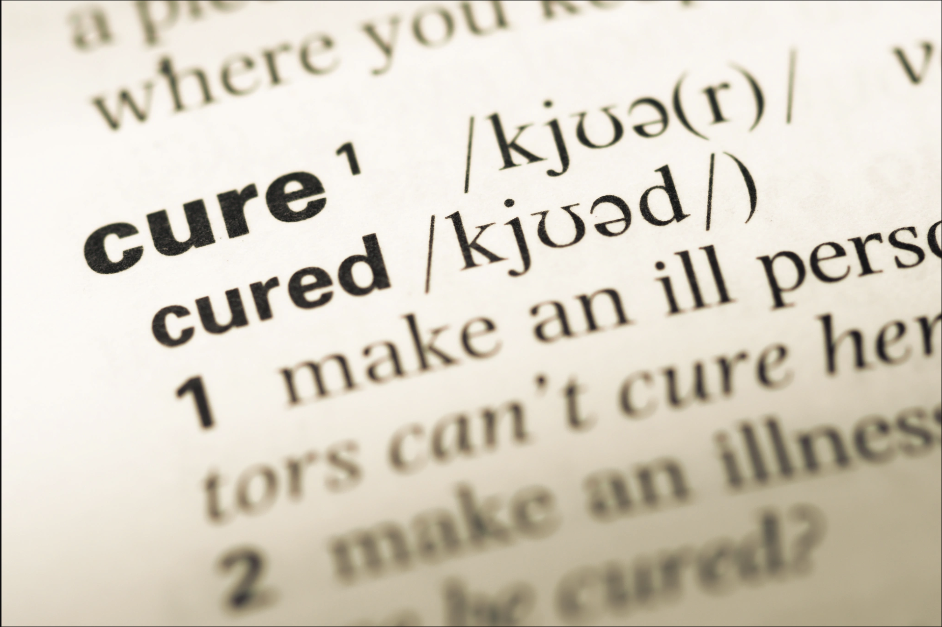 Close-up of a dictionary entry for the word cure, shown for editorial and educational context on the Malachi Gillihan trauma specialist website