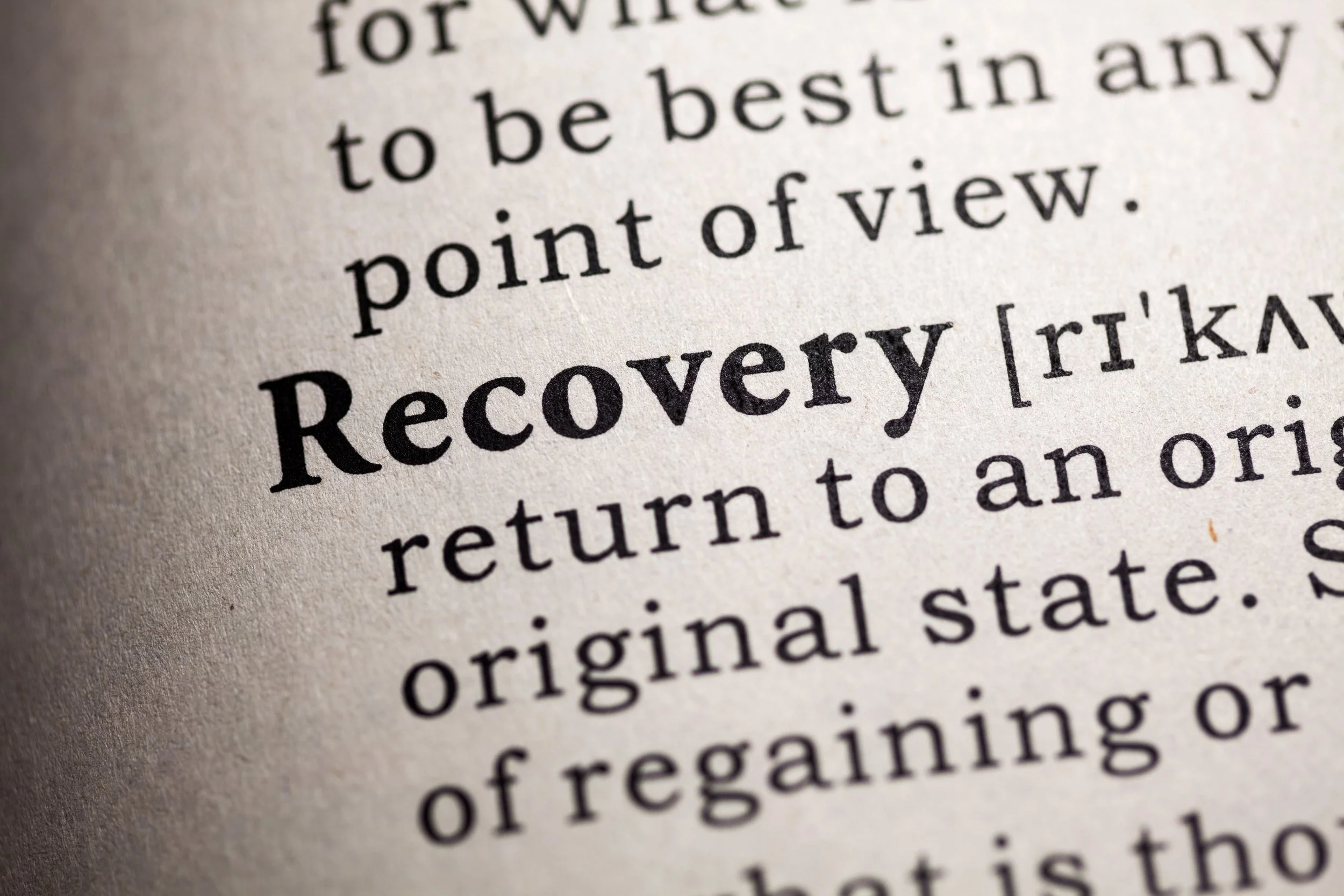 Close-up of a dictionary entry for the word Recovery, used as a header image for trauma healing resources and educational content by Malachi Gillihan, trauma specialist in Berkeley, CA