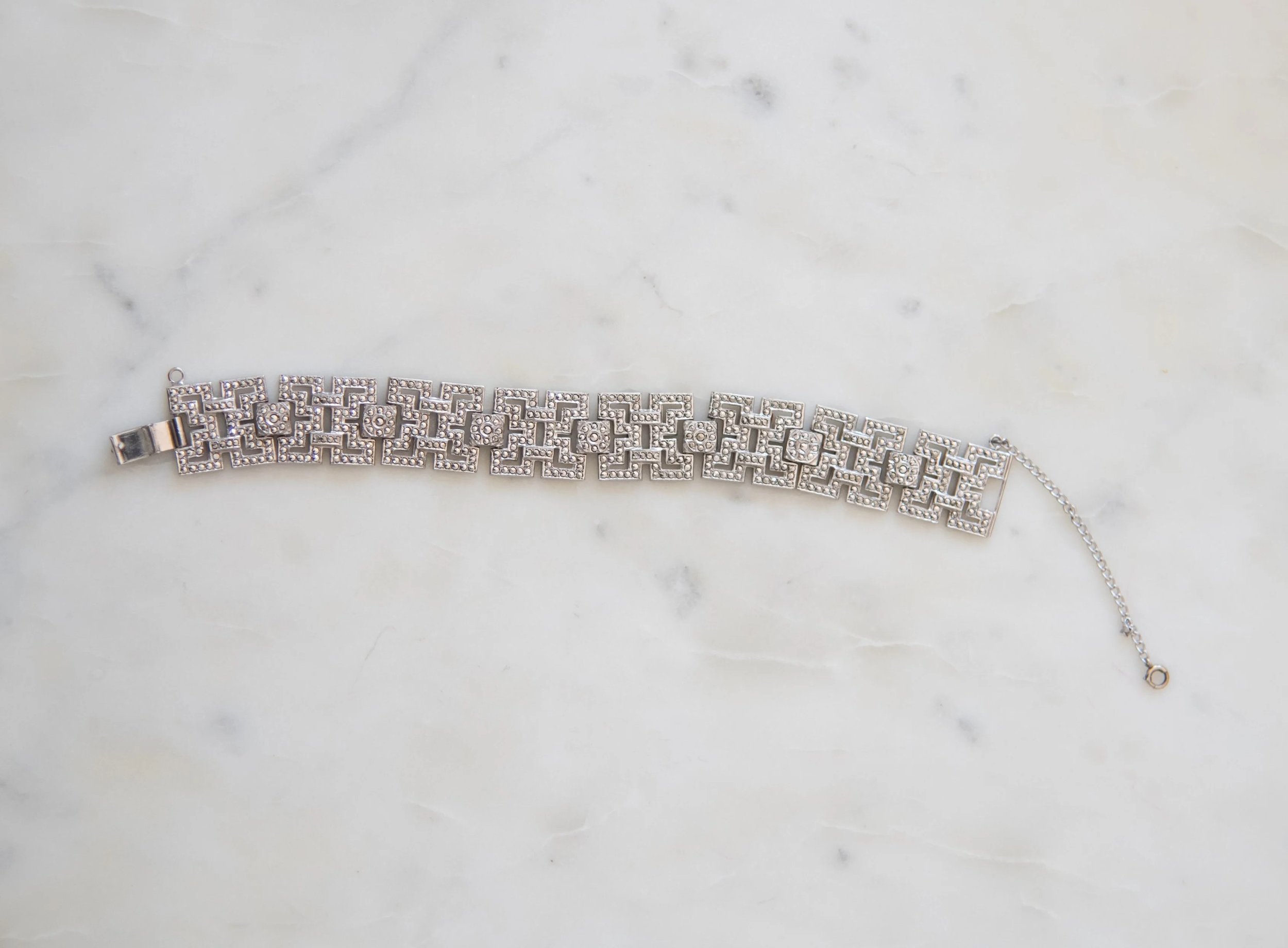 A sterling silver and marcasite bracelet with geometric links.