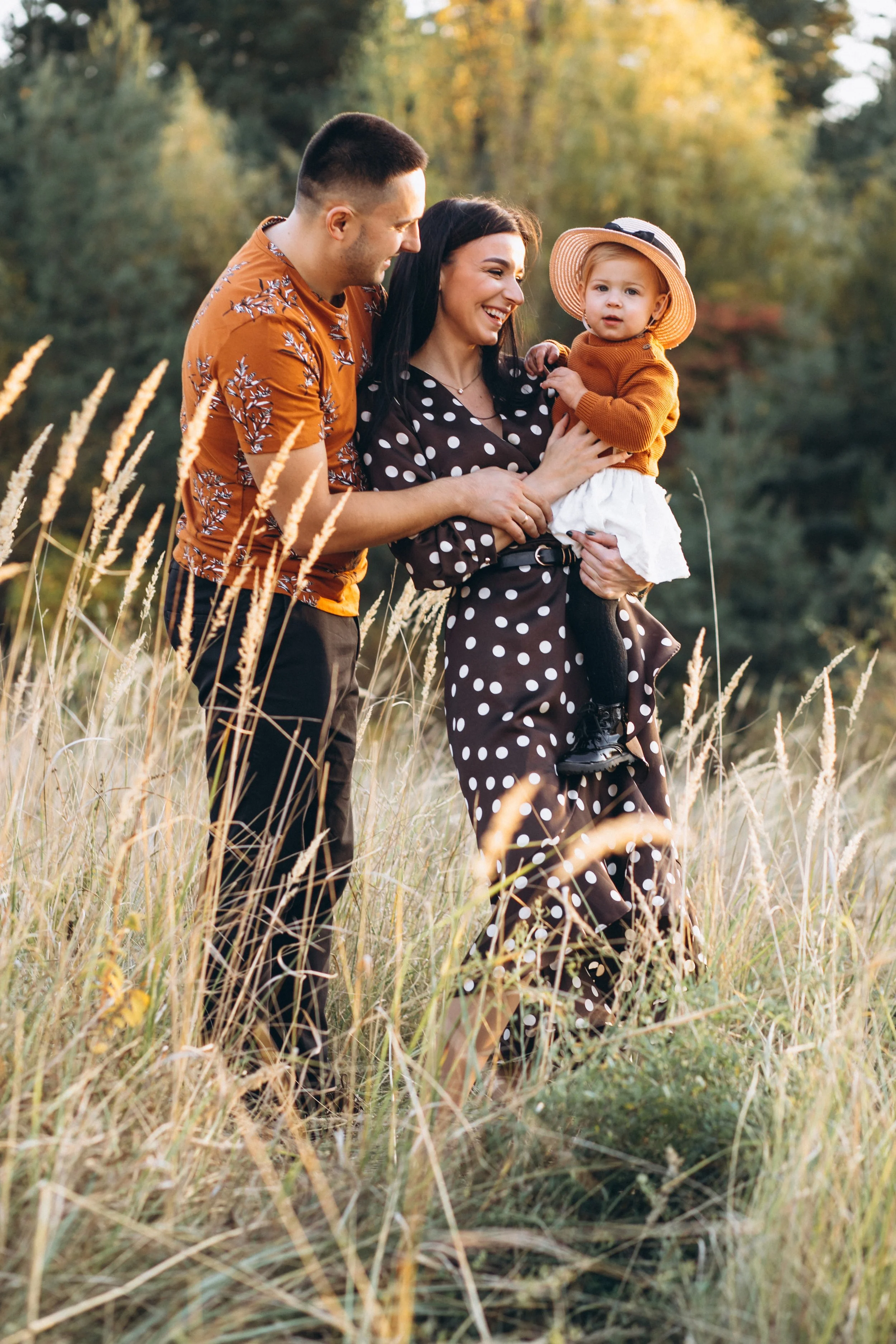 family-with-their-little-daughter-autumn-field.jpg