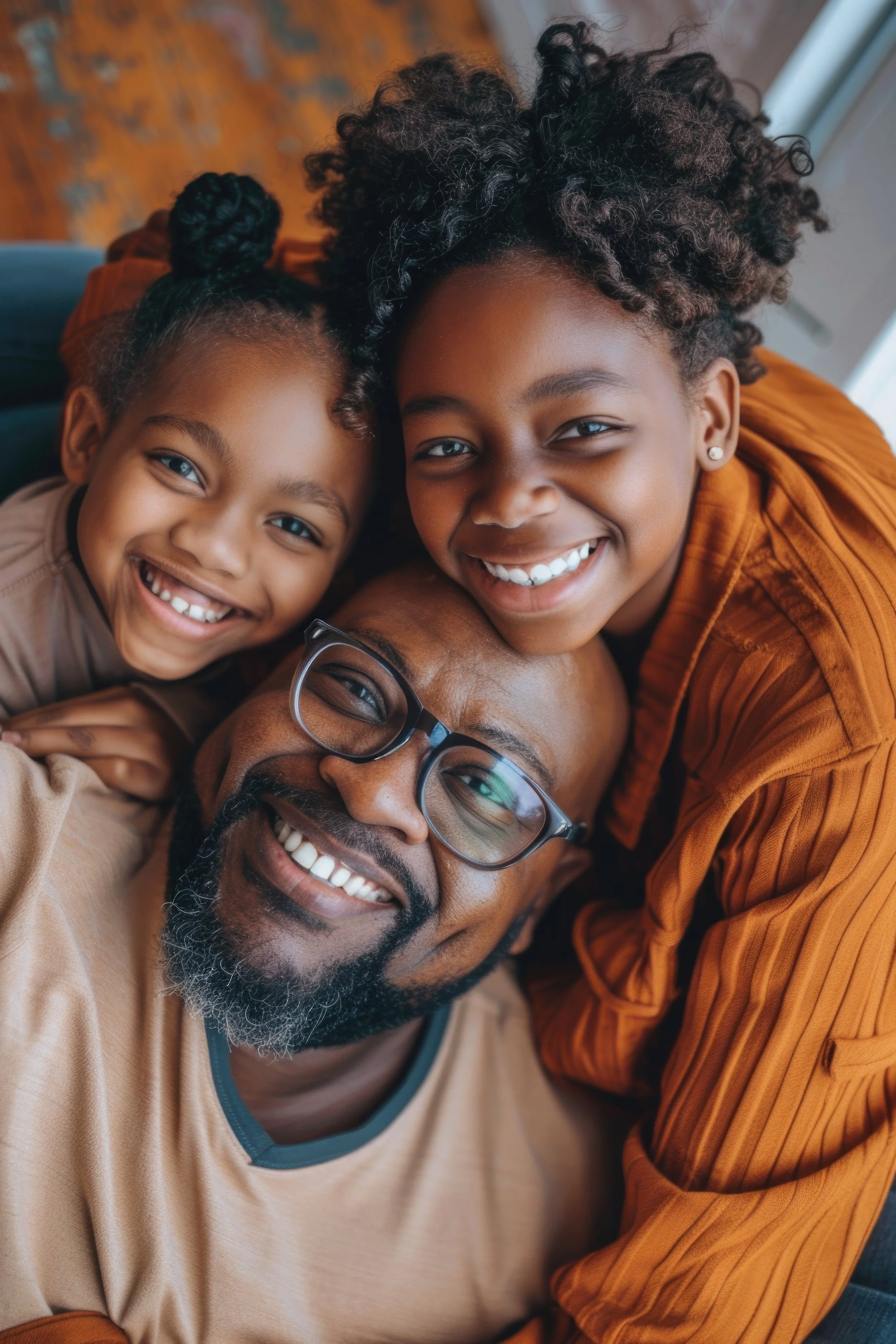 man-two-children-are-hugging-each-other-with-man-wearing-glasses.jpg