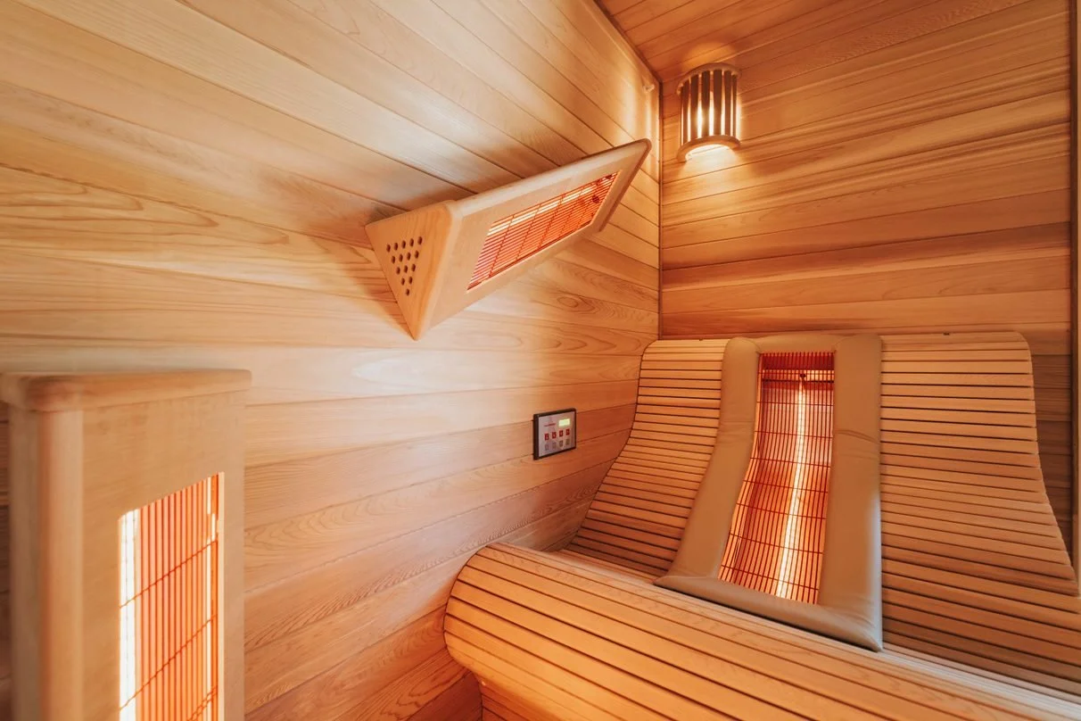 Custom infrared sauna featuring a lounger, designed, manufactured, and built by Alpha Wellness Sensations.