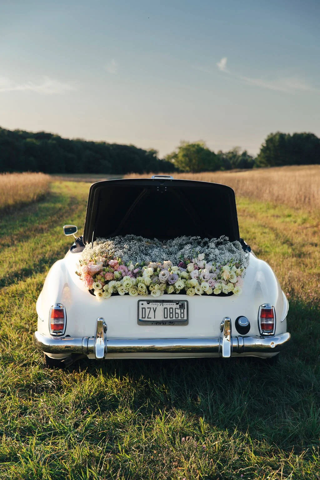 wedding car full of flowers.jpeg