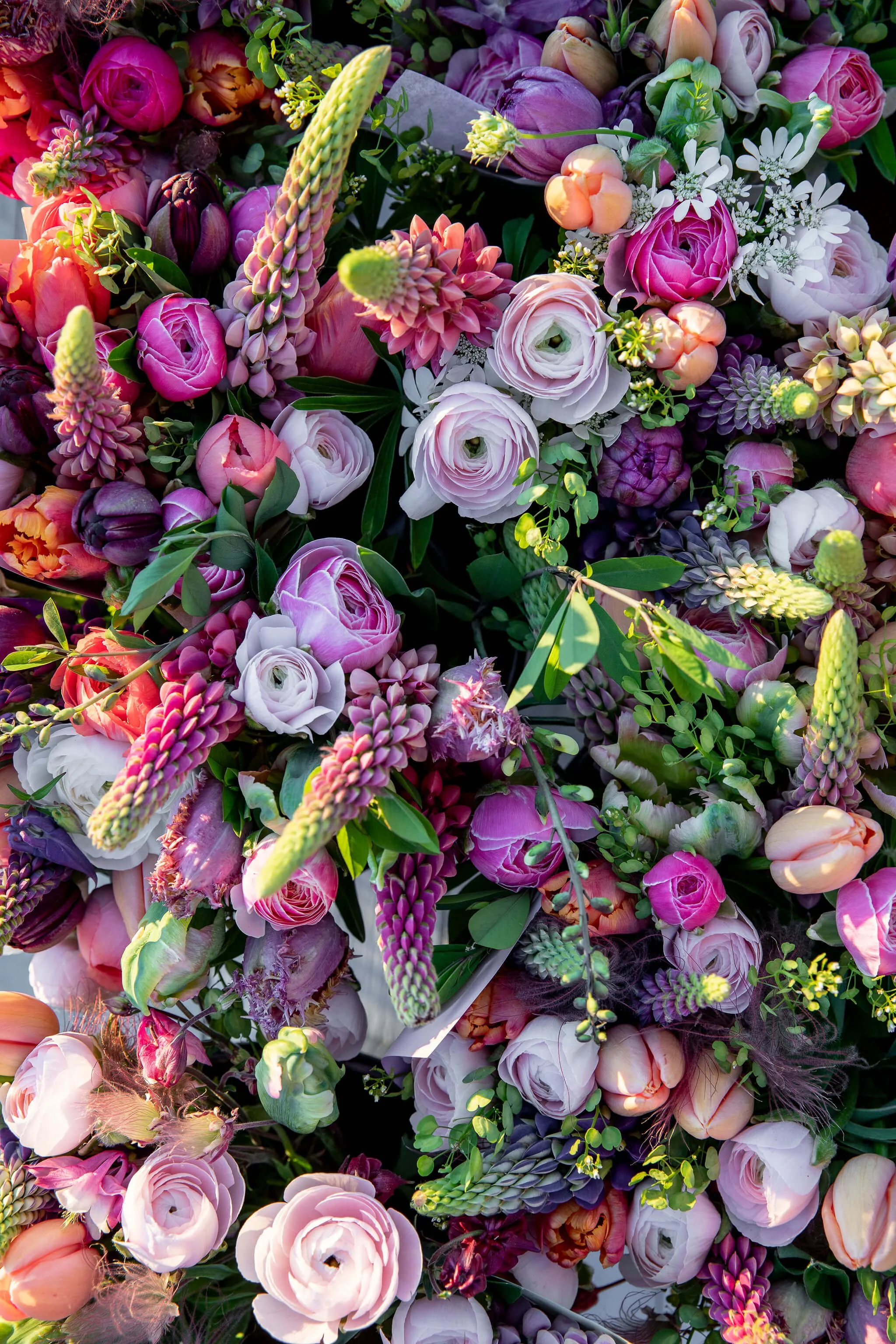Ranunculus and mixed flower buckets Traverse city.jpeg