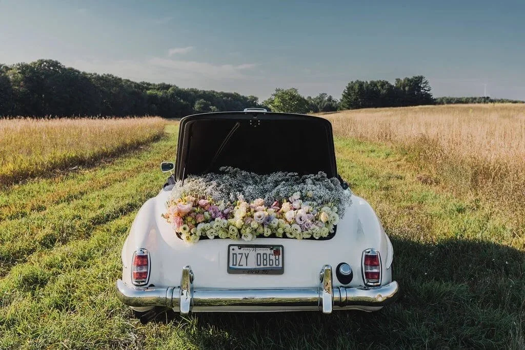 a car full of flowers at a wedding in Traverse City Michigan