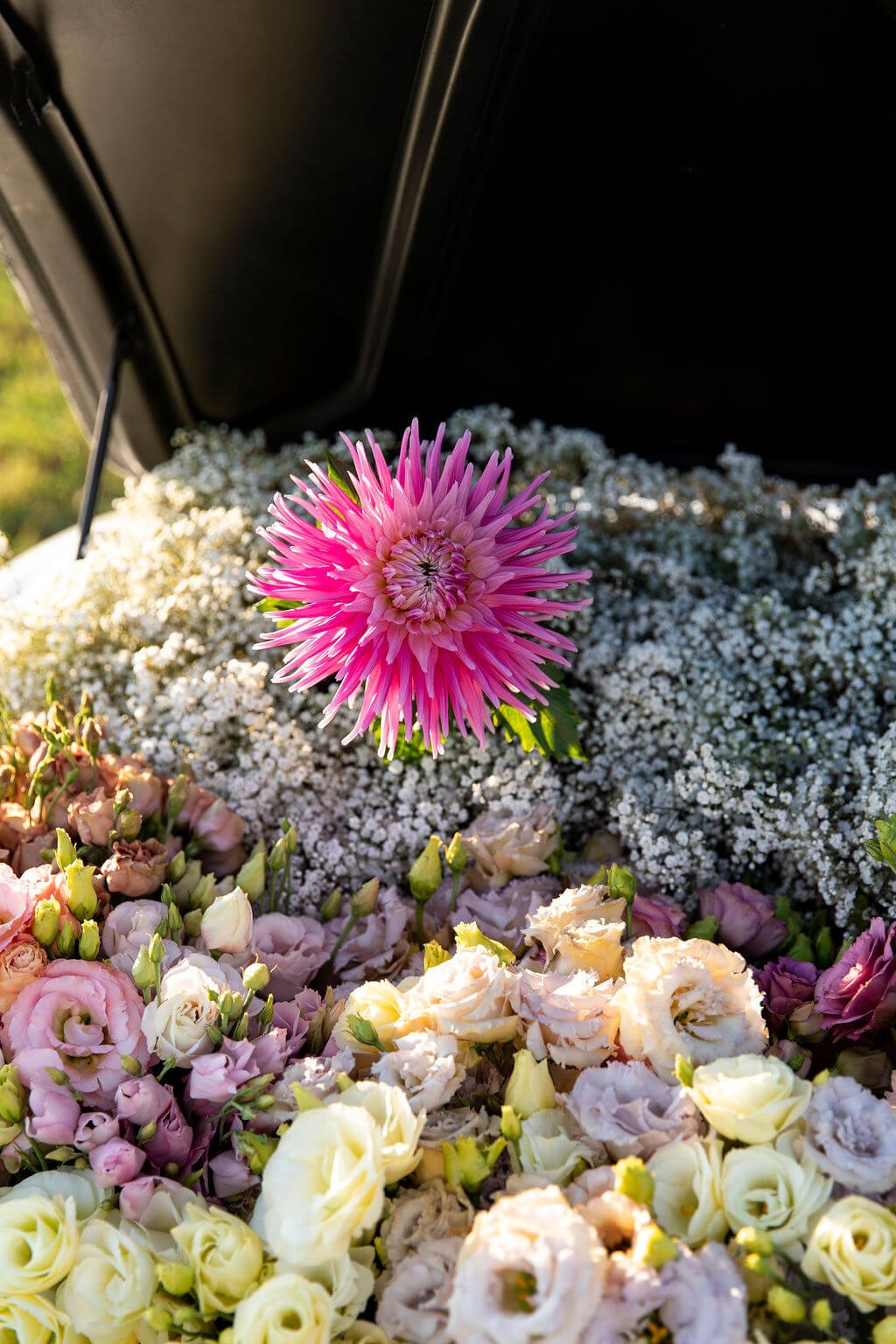 mercedes trunk full of flowers.jpeg