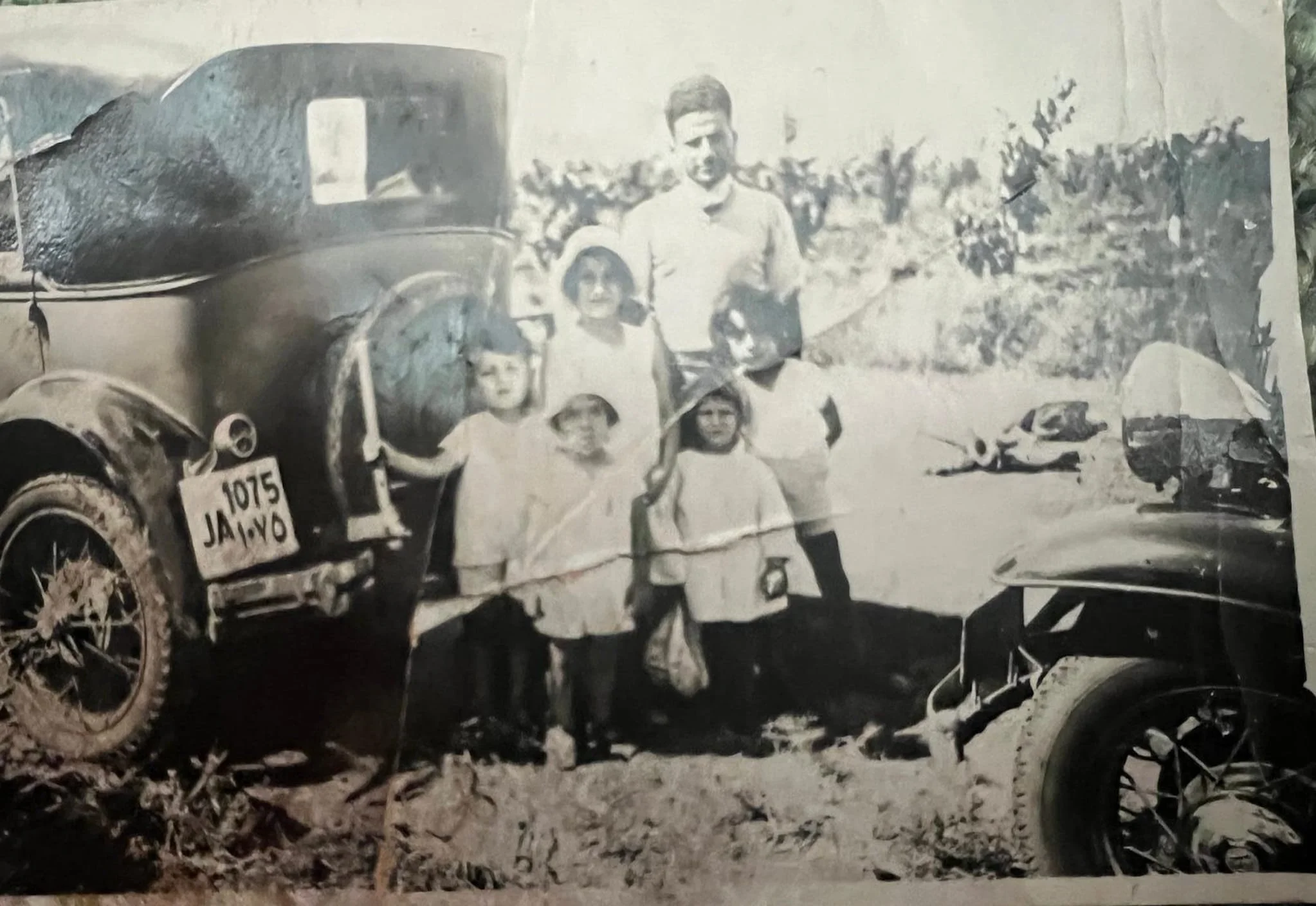 Counterclockwise, starting with the boy in front wearing the white hat: Robert Berouti, Yvette Gelat, Michel Berouti, Claire Gelat, and Alexandre Beyrouti. The adult male's identity is uncertain, but he is likely to be Victor Berouti.