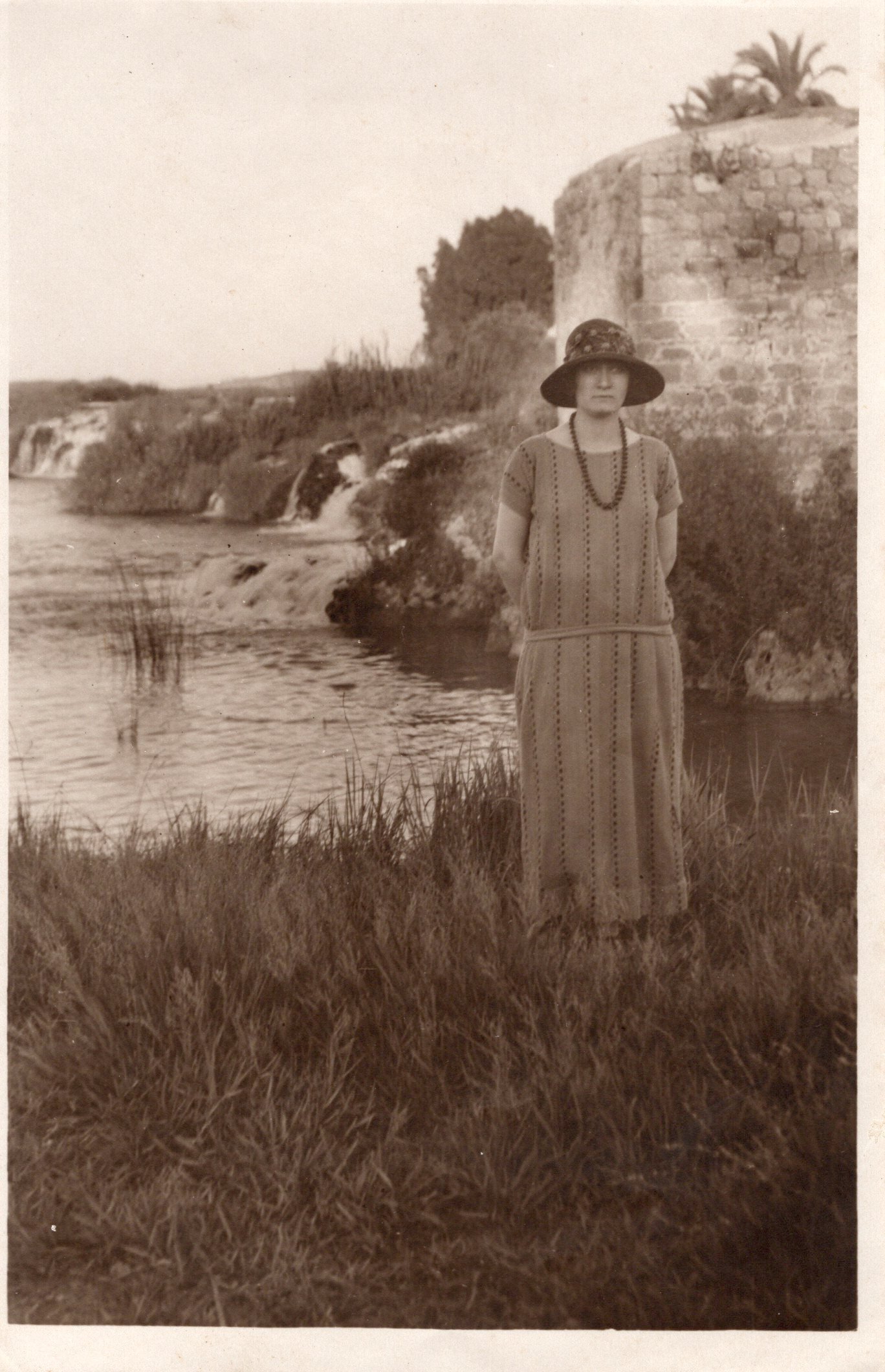 Victorine Berouti (née Zamaria), with the Auja river in the background, Jaffa, 1924