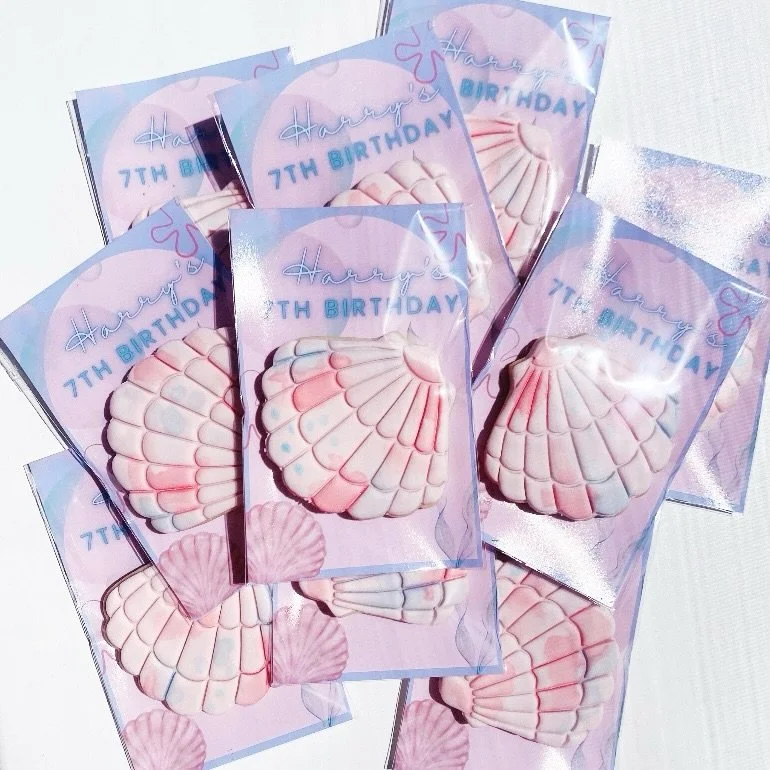 Harry&rsquo;s 7th birthday cookies for his class 🩷🩵

He chose pink and blue watercolour sea shells naturally, and I designed the backing card. 

Happy birthday my little beautiful boy best friend. ILYSM.