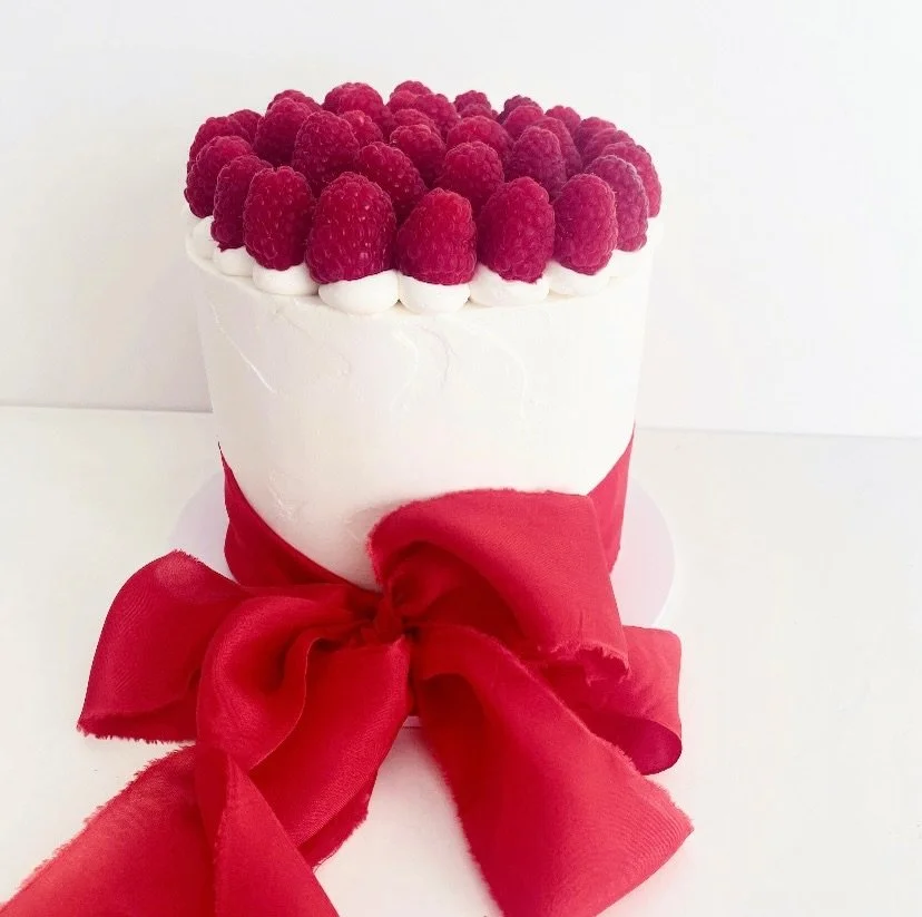 Raspberry topped cake with silk ribbon 🎀