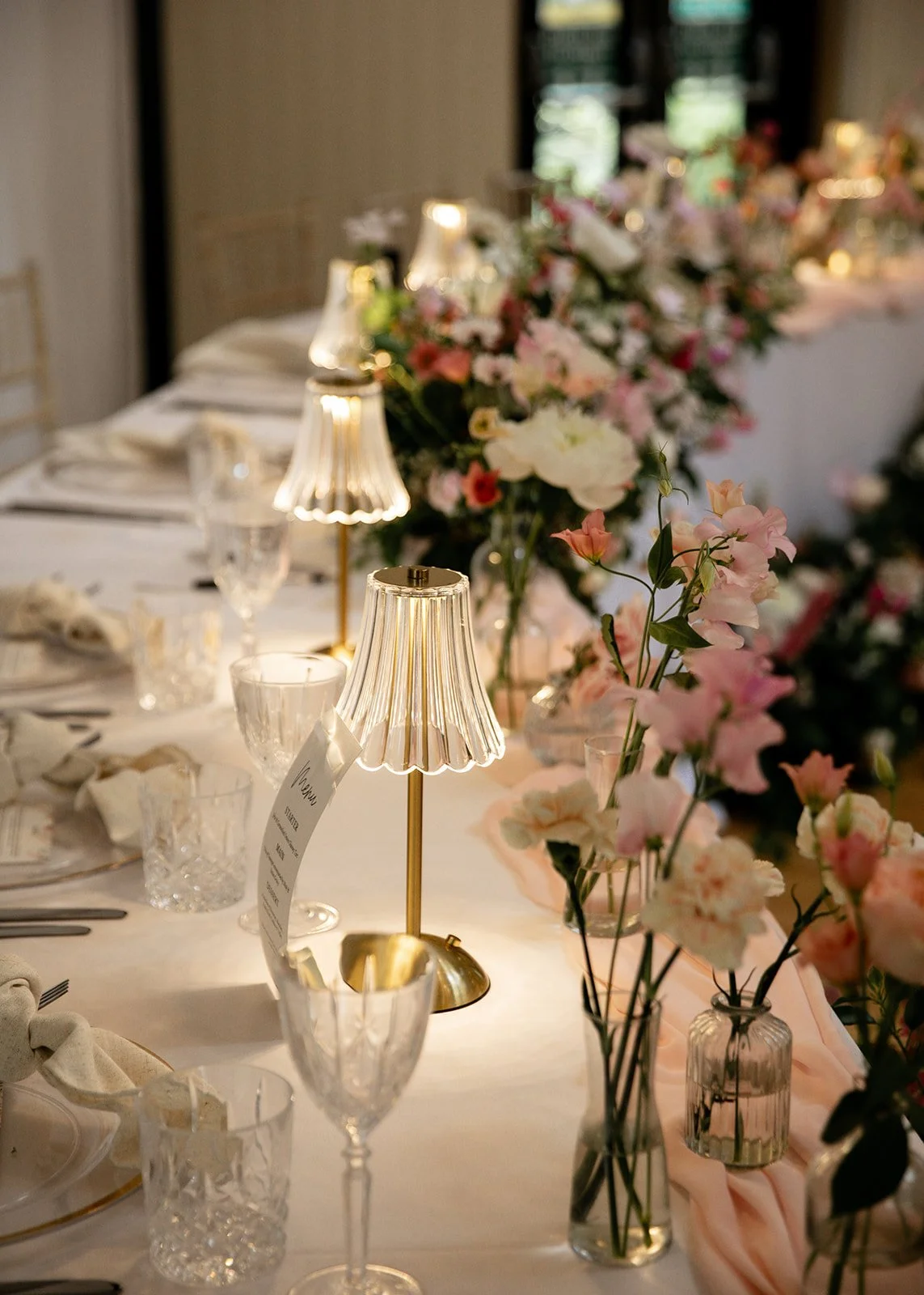 Wedding reception top table wedding flowers