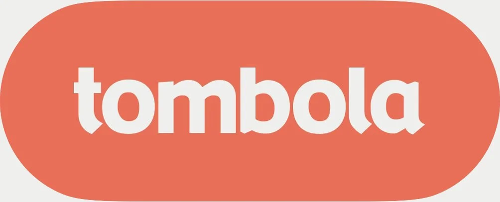 Tombola logo with white lowercase text on an orange oval background.