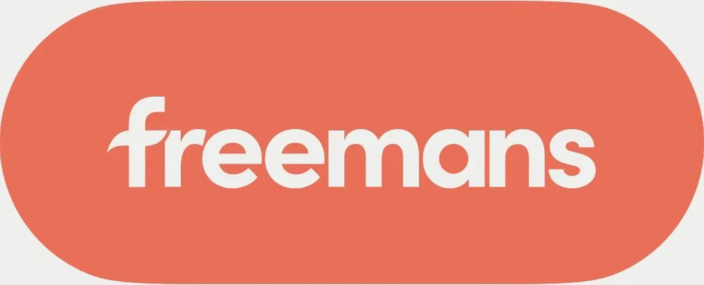 Freemans logo with white lowercase letters on an orange oval background.