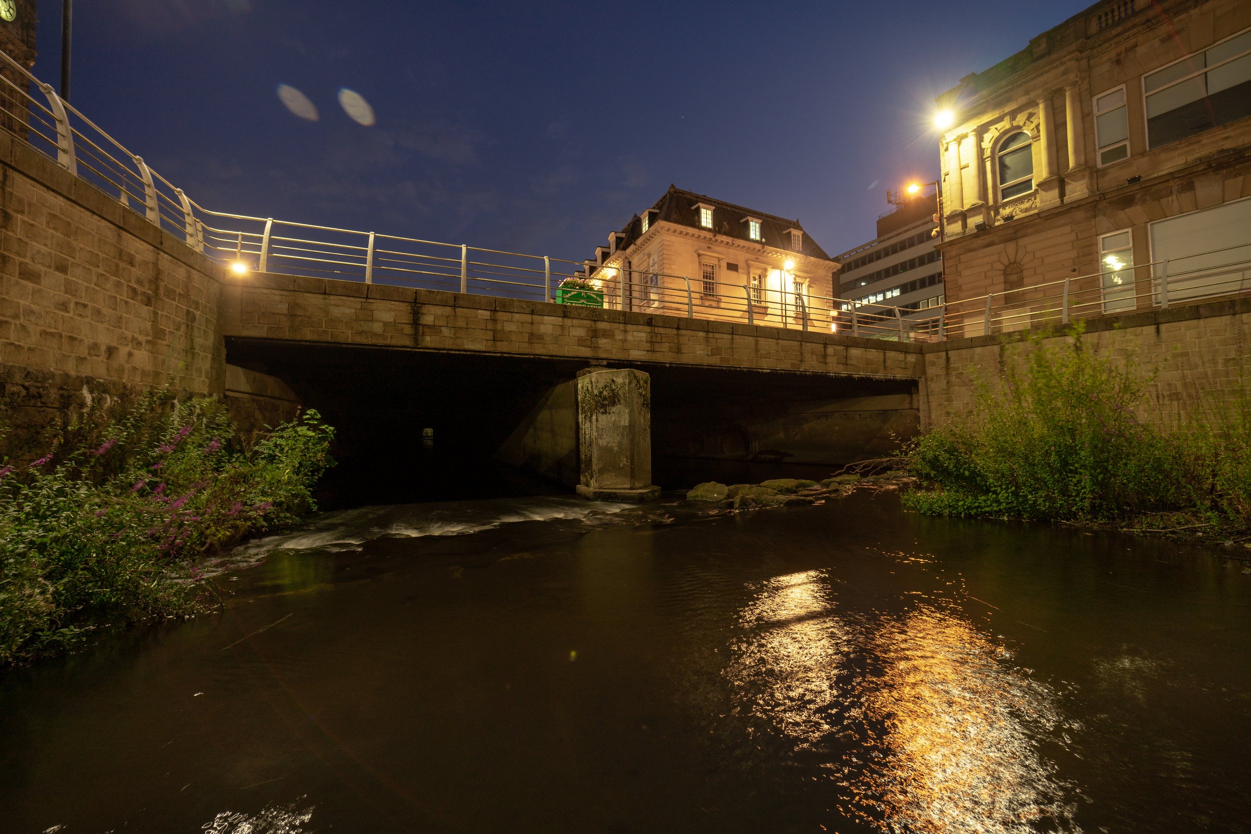 Around half way through the culvert it opens to air revealing a bridge above.