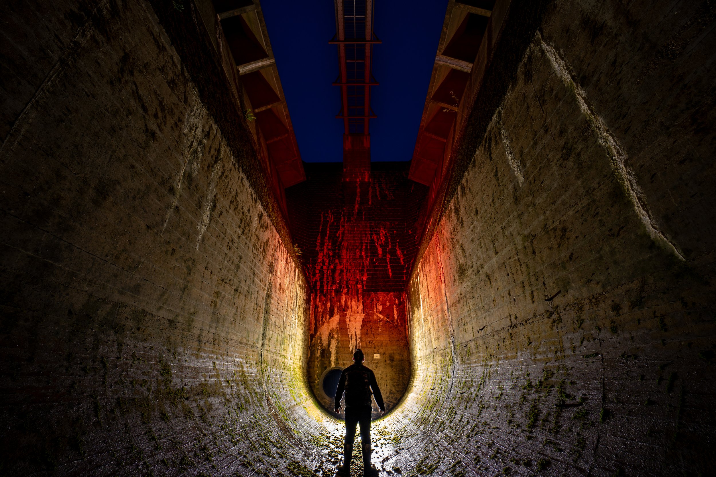 Beneath the spillway.