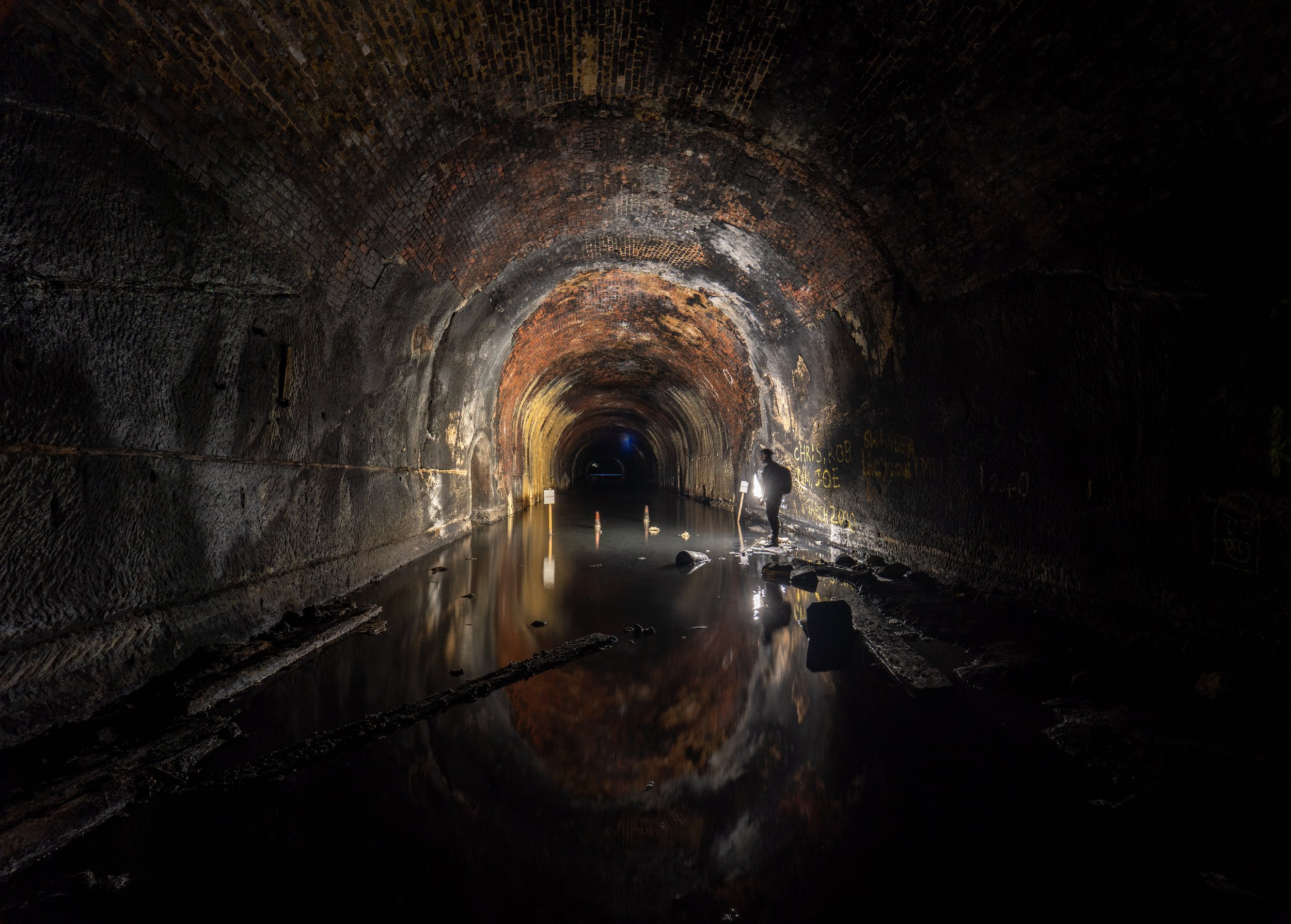 Around a three quarters of the way in the tunnel is flooded, it can be crossed in waders.