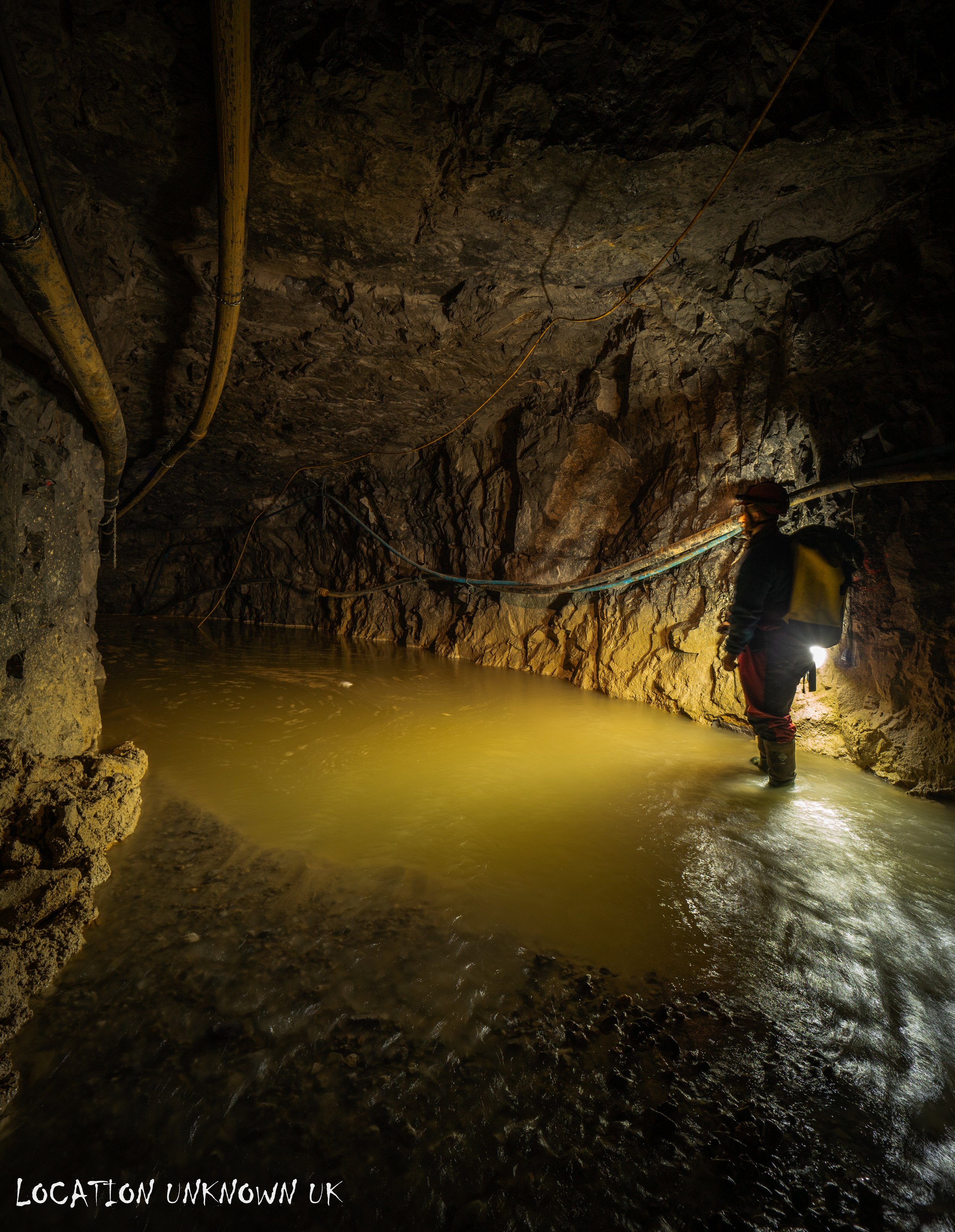 As we approached the start of a long journey ahead there it was, a sump. Where the water met the ceiling I guessed it was around a 40 minute long walk to where I wanted to get to and with sub level 3 pumps being turned off and removed it was now com