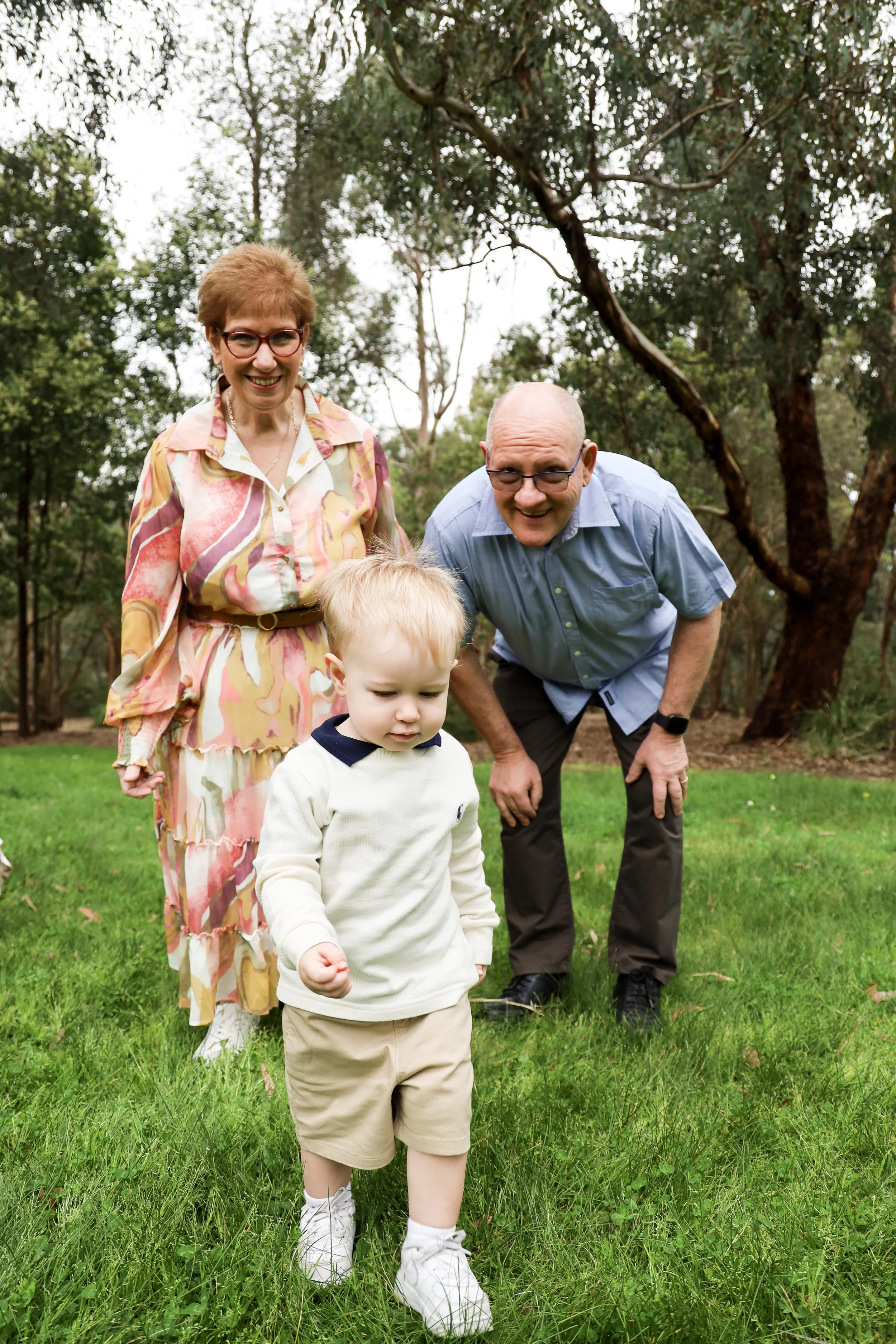 grandparents watching grandchild walk away