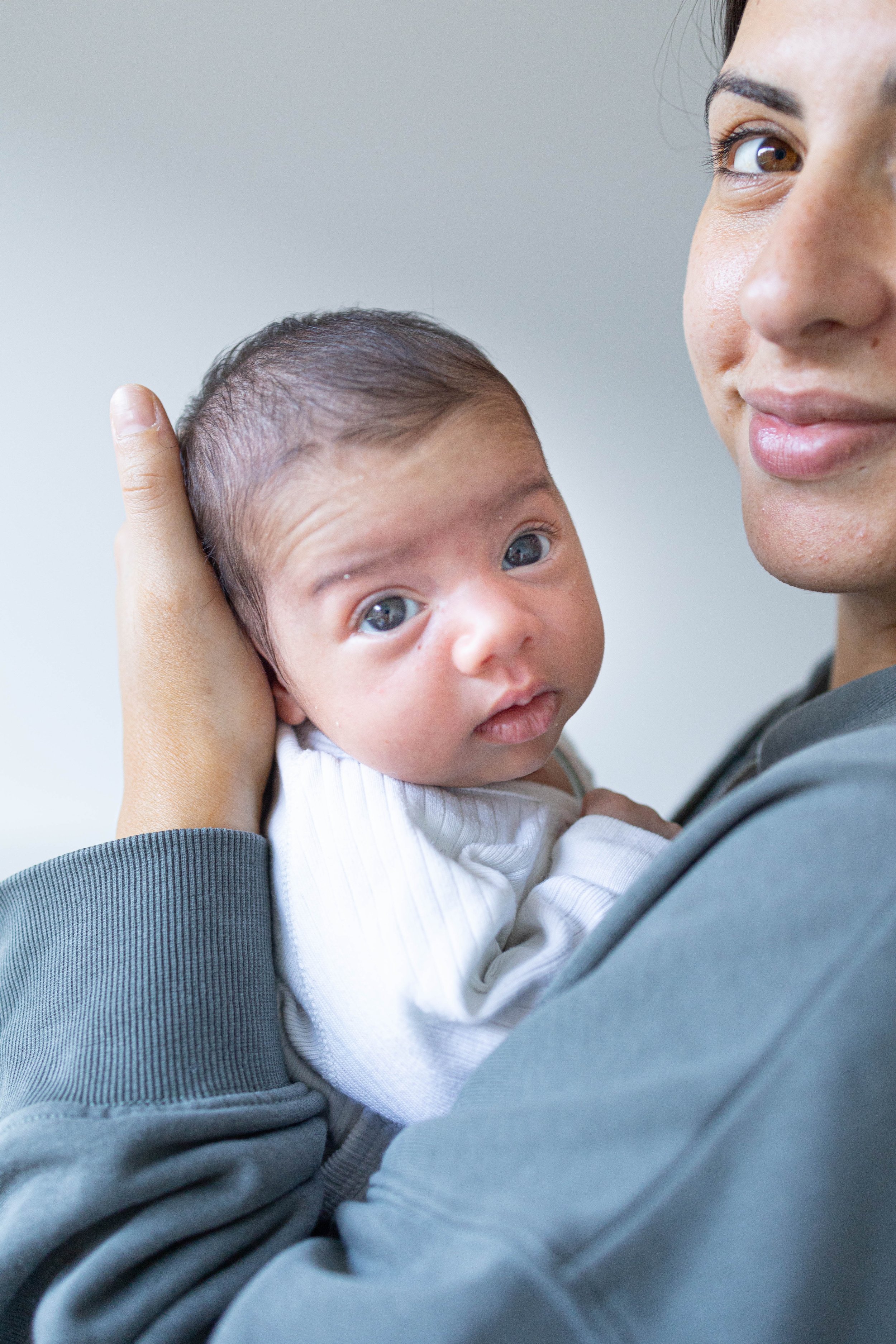 newborn held by mum 