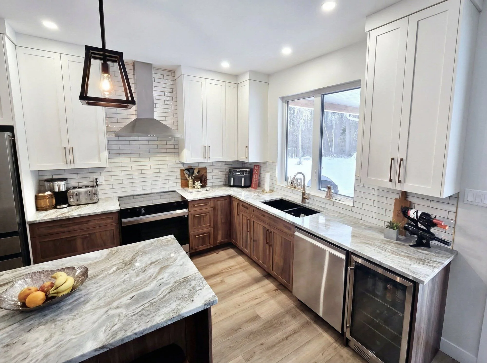 Walnut kitchen with marble countertop with black sink