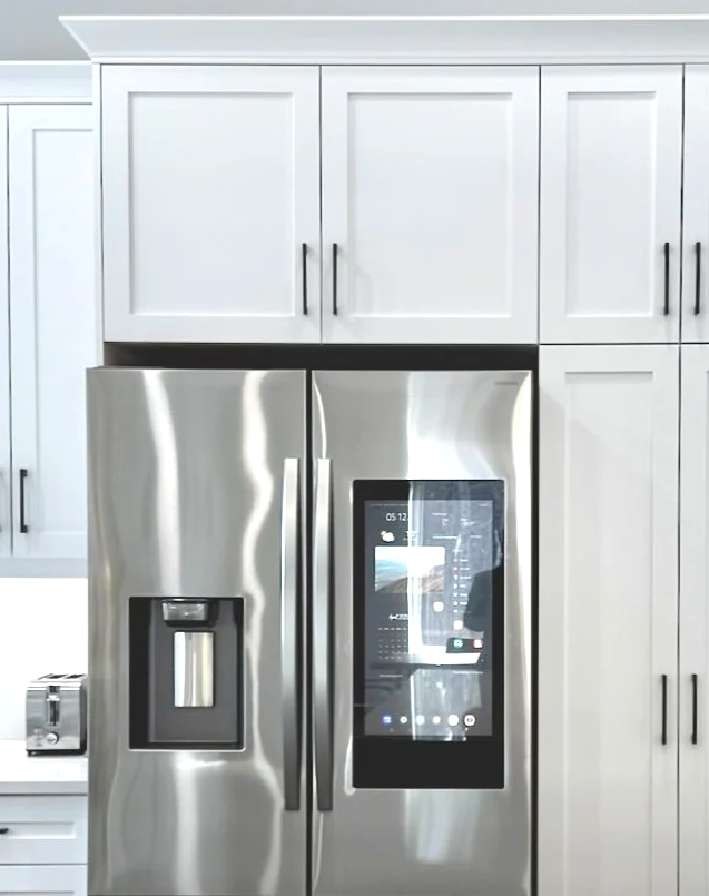 Suggested alt text:  Skilled craftsman hand finishing a custom cabinet door in the Bob and Marks Custom Cabinets workshop in Pembroke Ontario