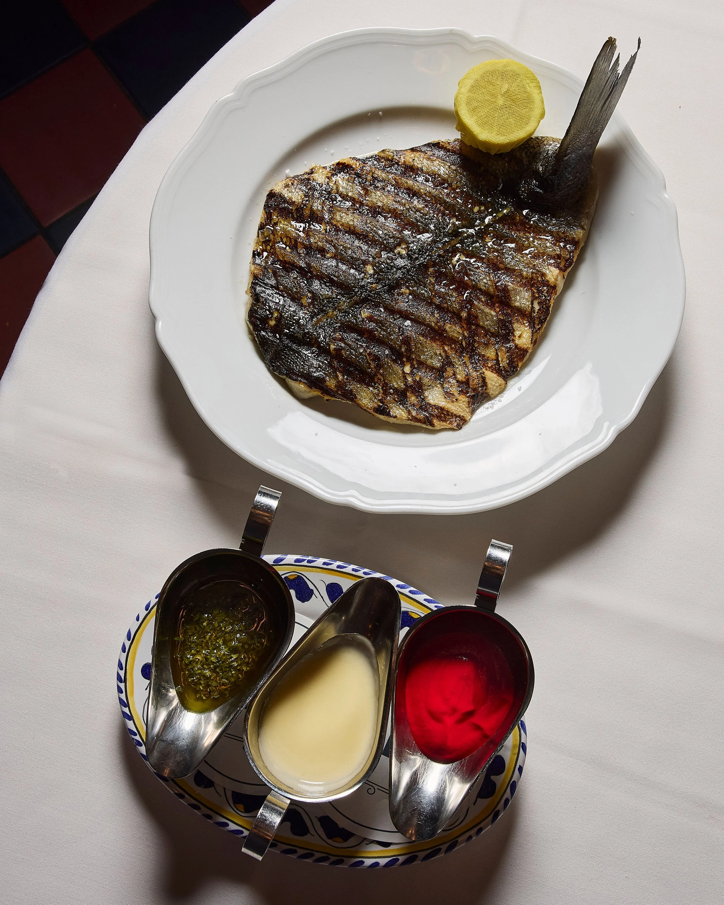 Carbone London Mayfair restaurant Branzino Sauce Trio and fish.jpg