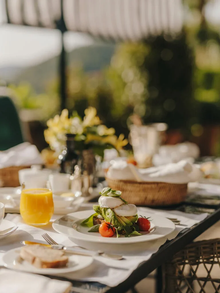 Gran-Hotel-son-net-mallorca foutdoor dining talbe and food .webp