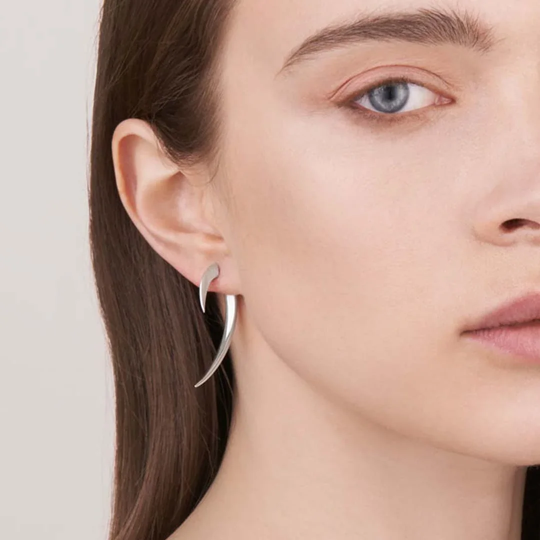 model-wearing-shaun-leane-london-hook-earrings-small-silver.jpg.webp