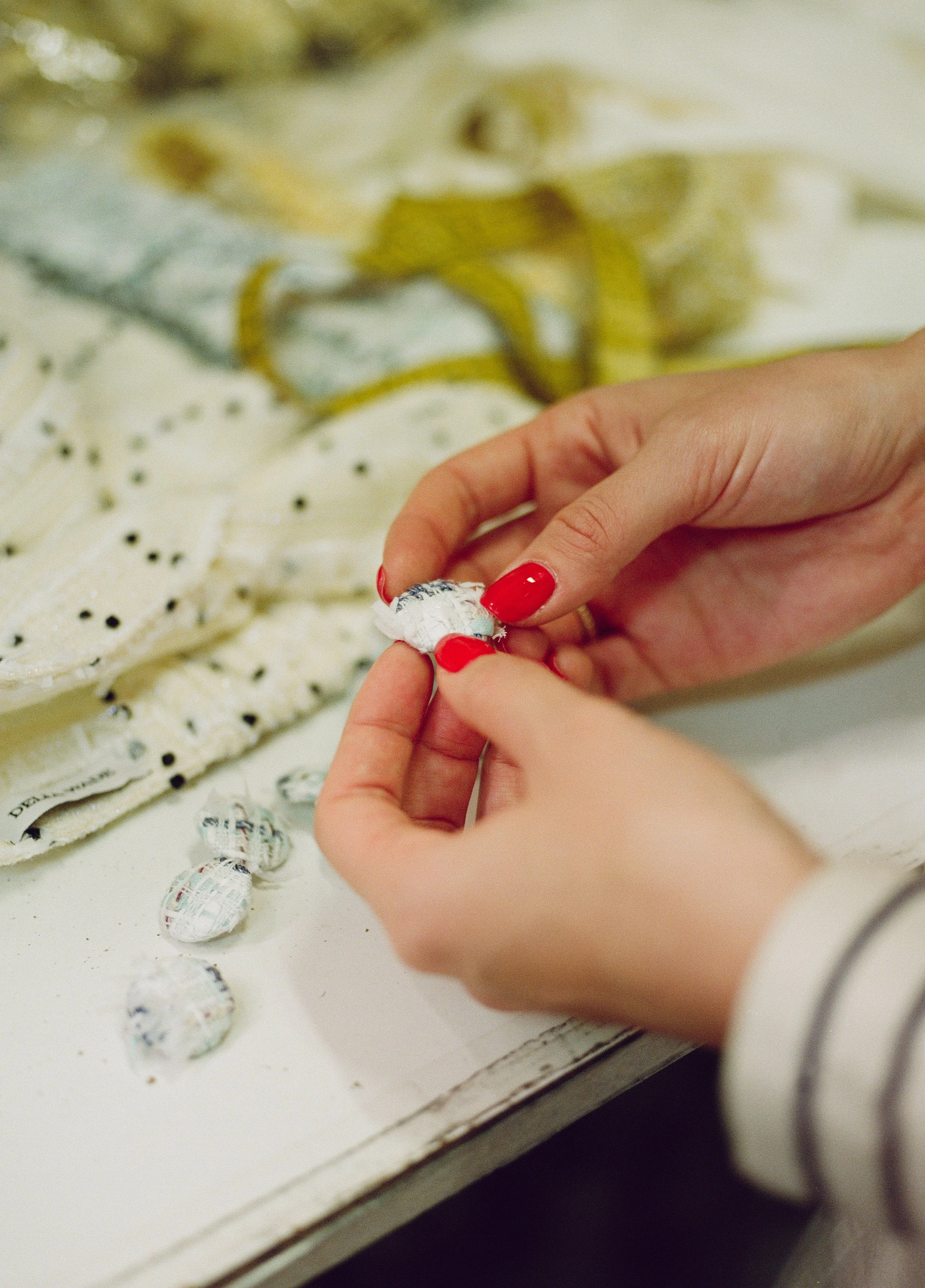 Delia Wade Fashion Designer making clothes using tweed in her studio