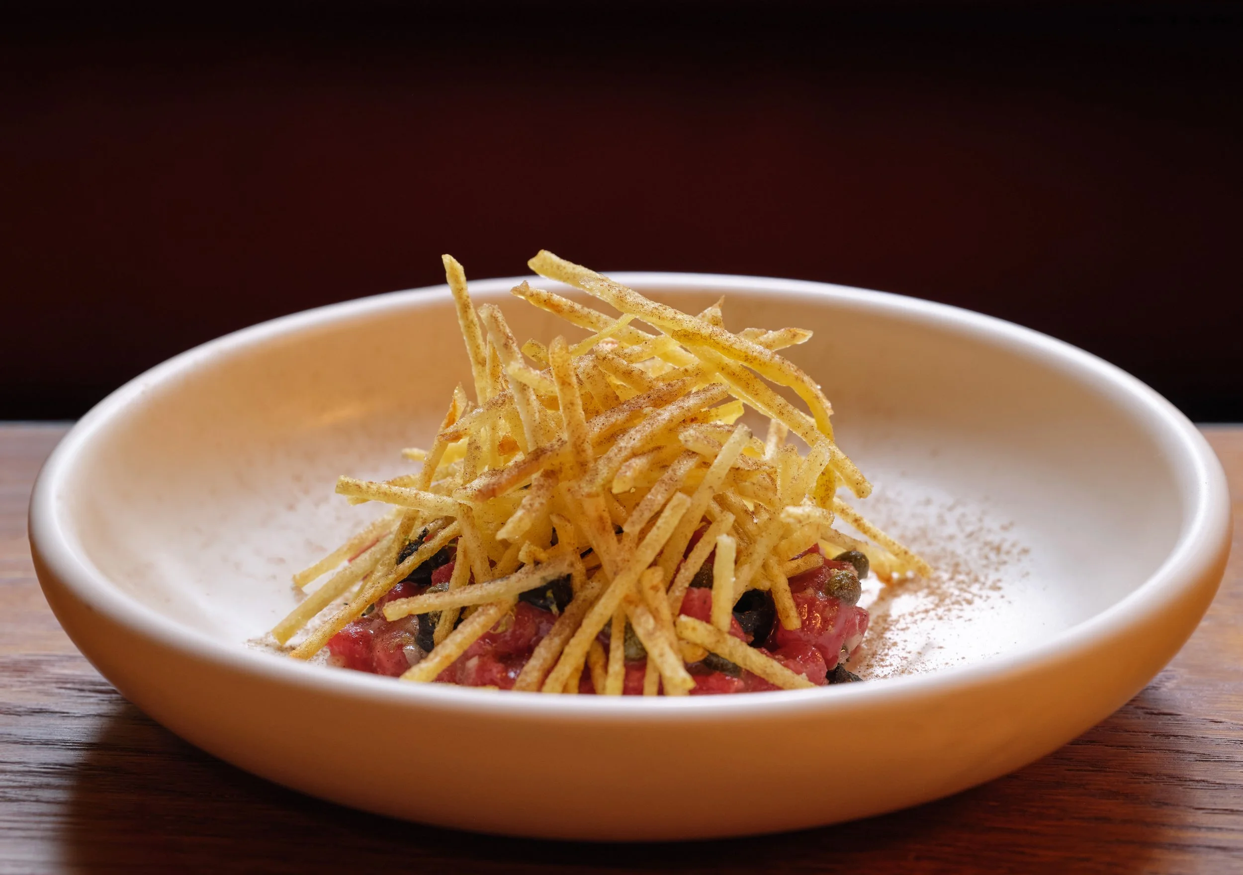 Motorino Italian Restaurant Fitzrovia London Chopped Dexter, fermented green chilli, porcini ketchup, shoestring friesj