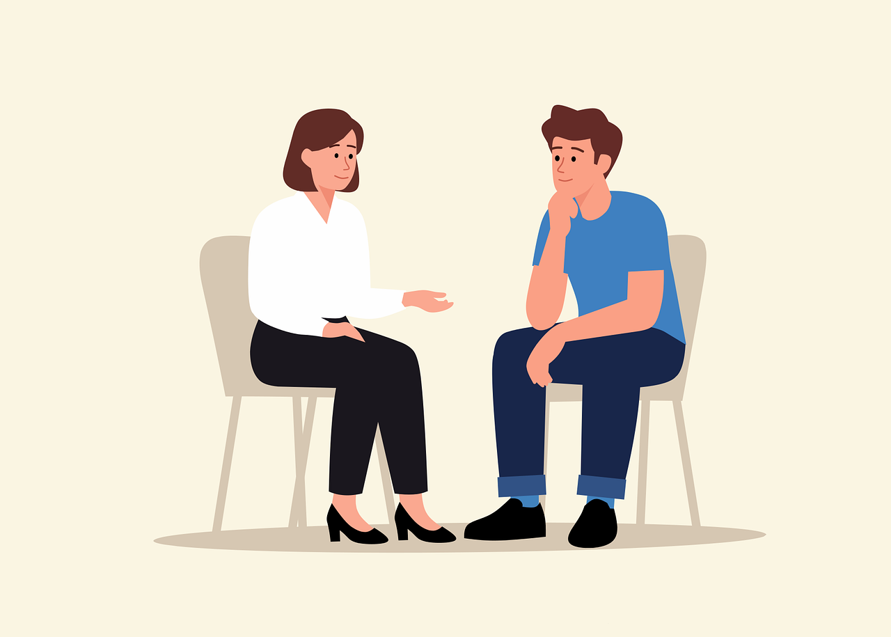 Therapist discussing how to become a therapist with new graduate