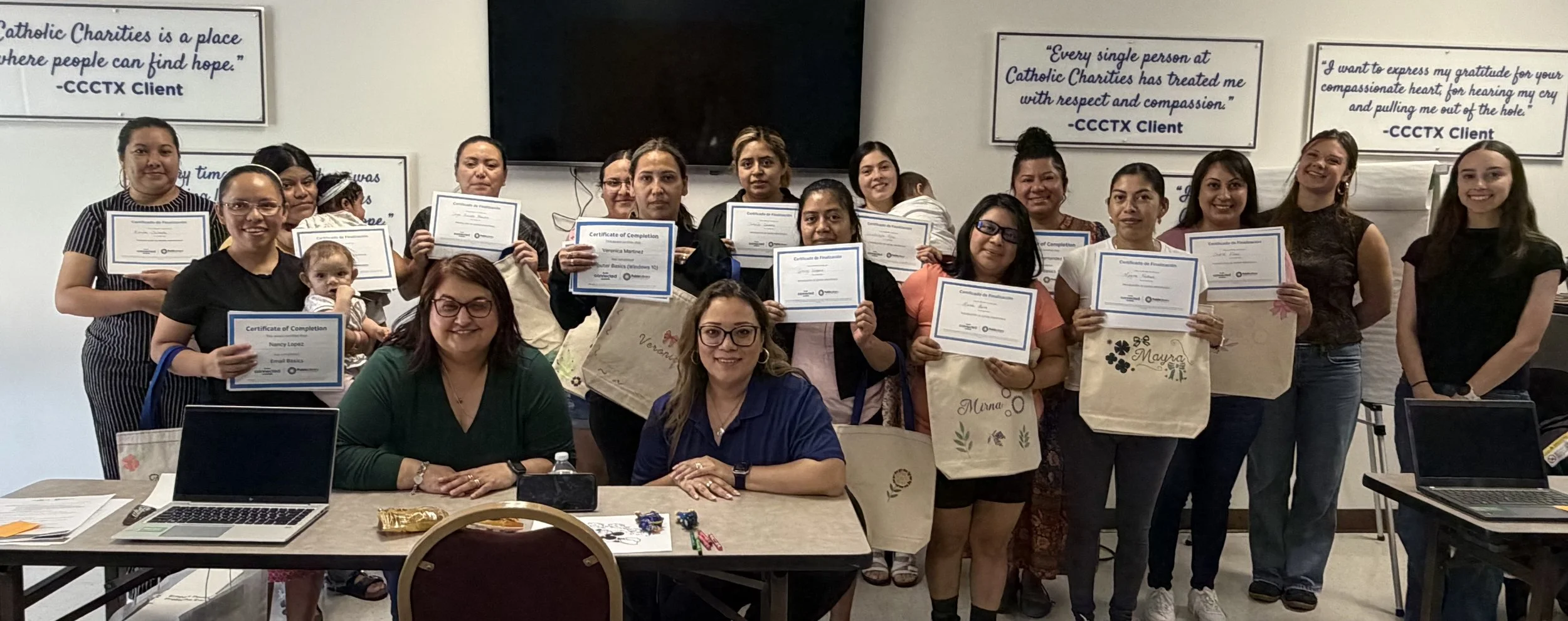 Participants and staff celebrate the complete of the workshop series at Catholic Charities of Central Texas.