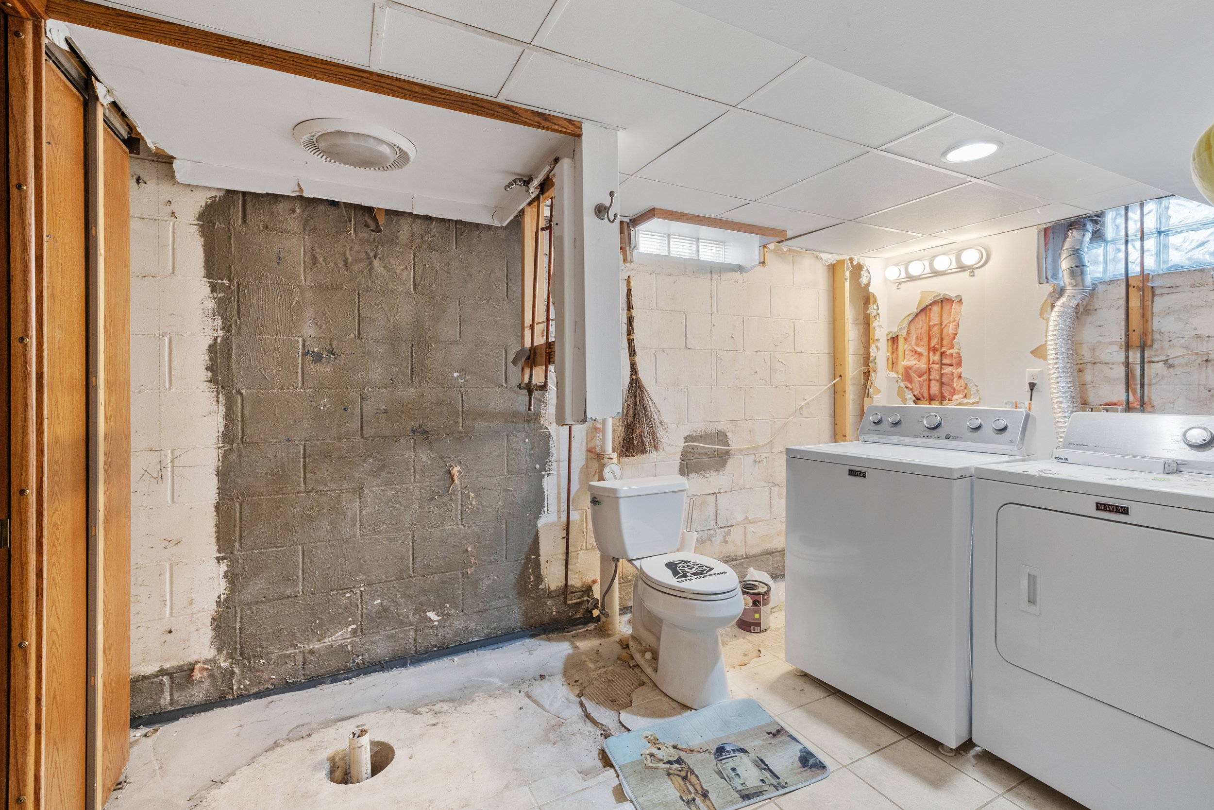 Laundry room in basement with plumbing for 2nd full bath
