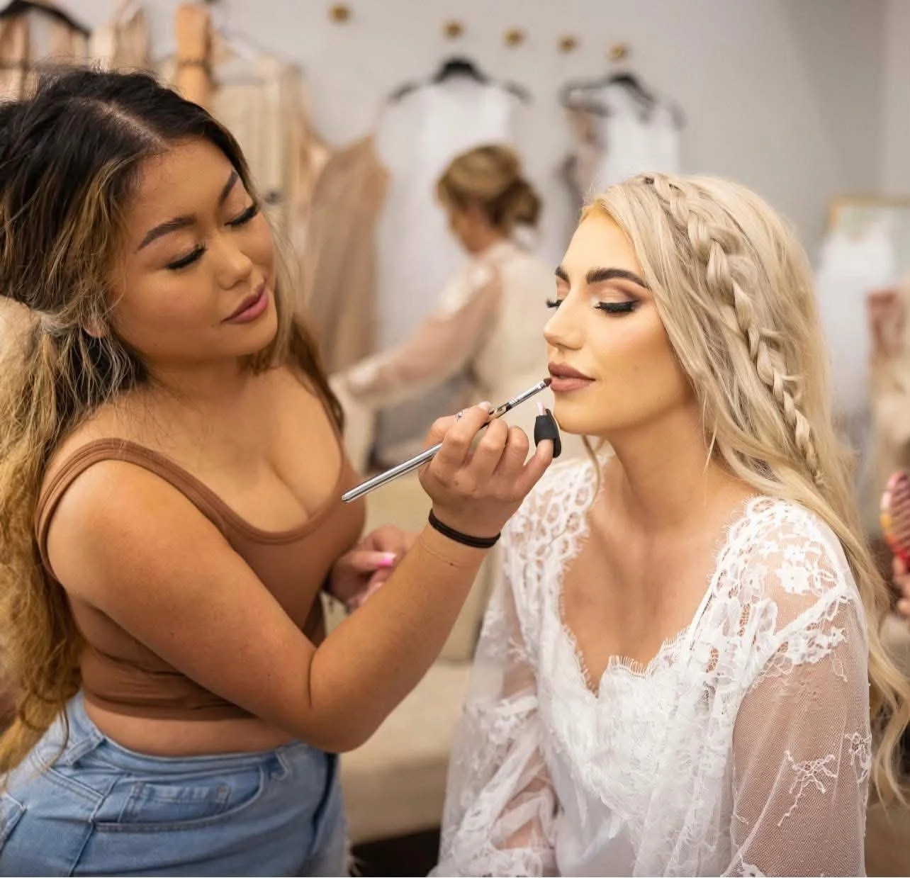 Mangda applies makeup in bride