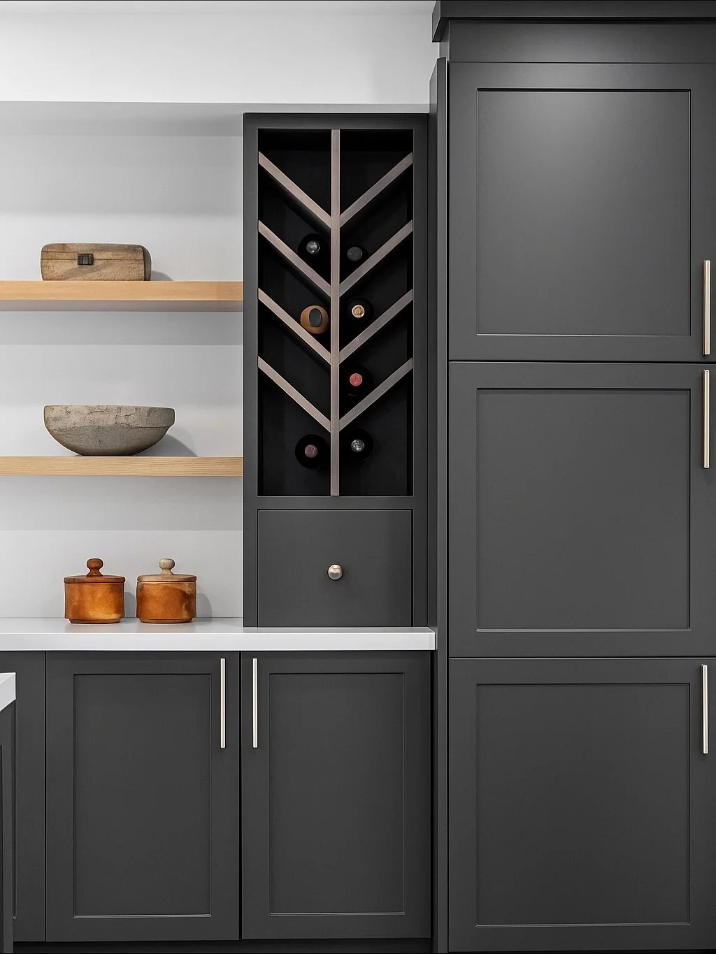 Site-built wine cabinet: this piece was added after the rest of the cabinetry was already installed. The original plan was for the chevron wine rack to match the floating shelves, but once the homeowner saw it in place, they decided to stain it inste