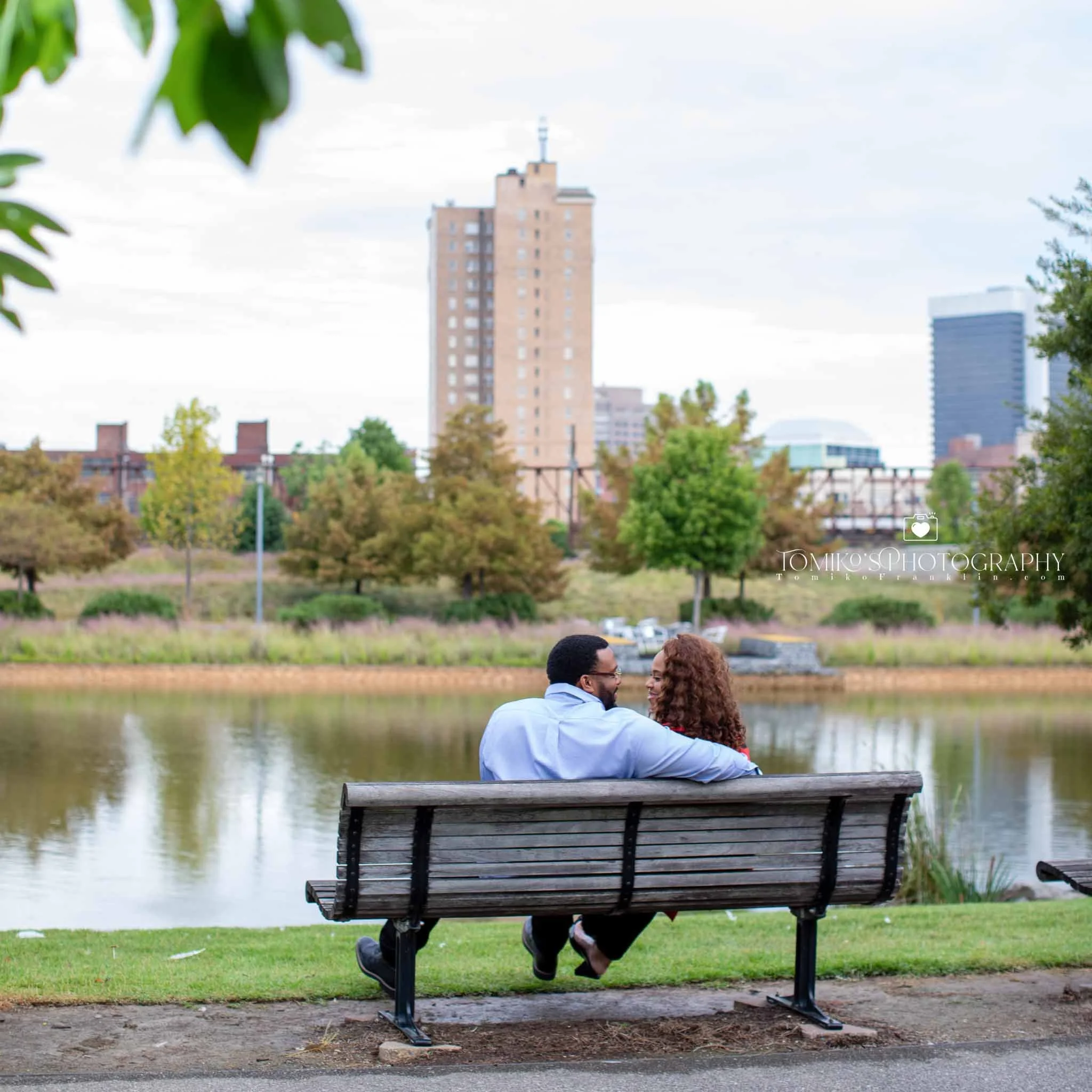 Couple looking into each other’s eyes during a golden hour engagement session at Railroad Park in Birmingham AL.