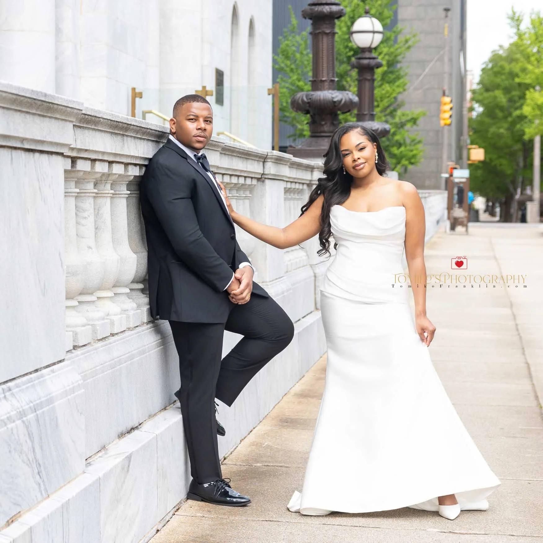 Couple embracing during a small elopement ceremony in downtown Birmingham.