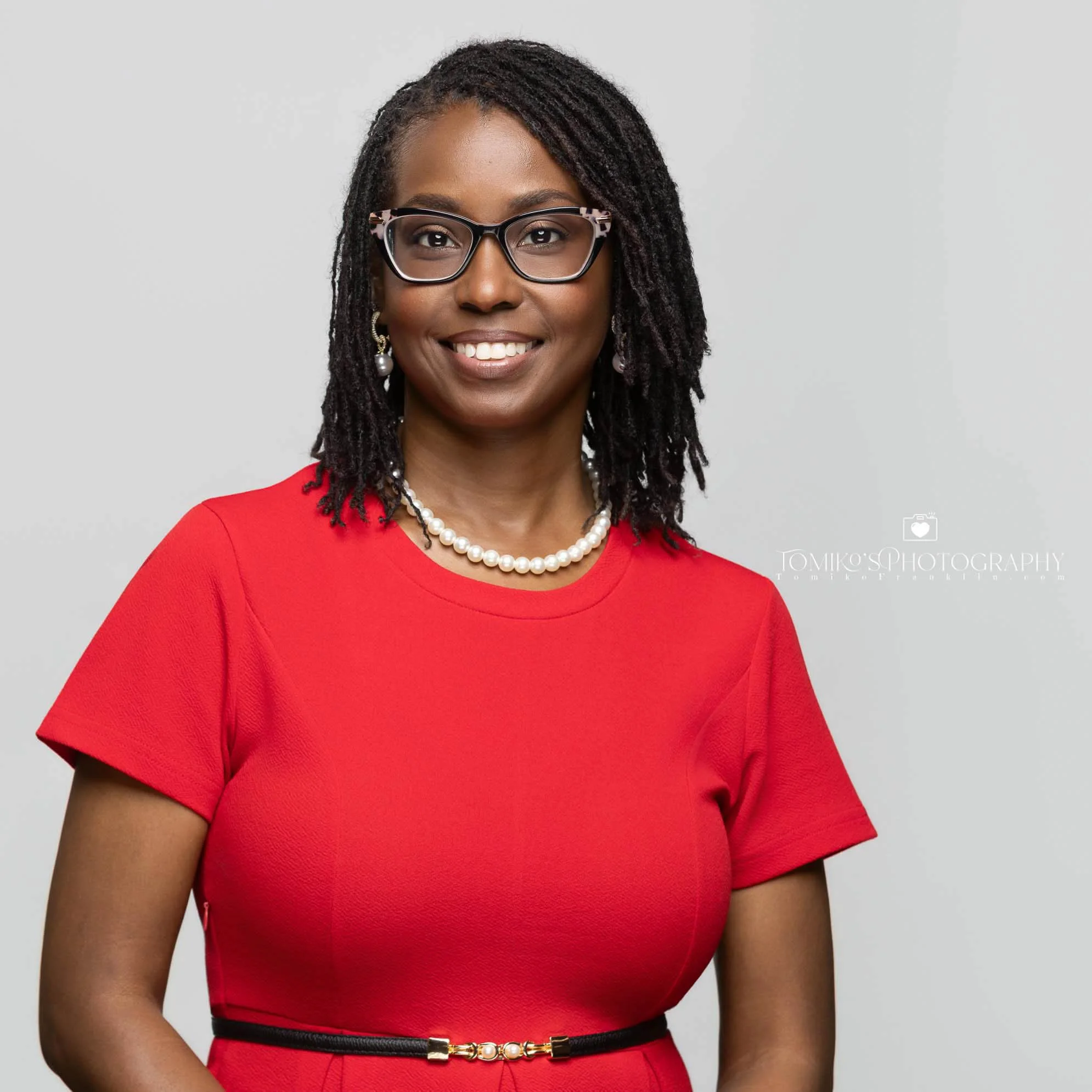 Professional studio headshot of a woman, captured in Birmingham, Alabama, showcasing a confident and polished appearance for business or corporate use.