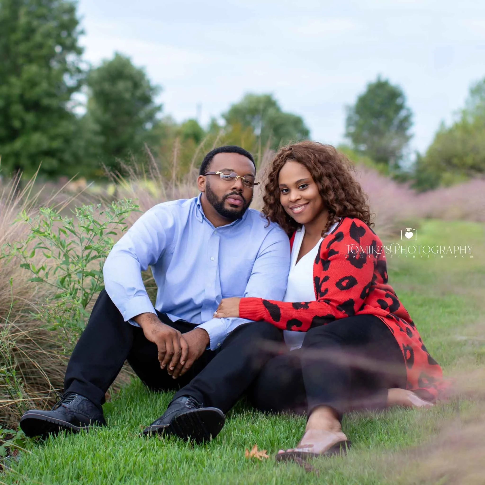 Engagement couple holding hands at Railroad Park during golden hour, captured by a Birmingham engagement photographer.